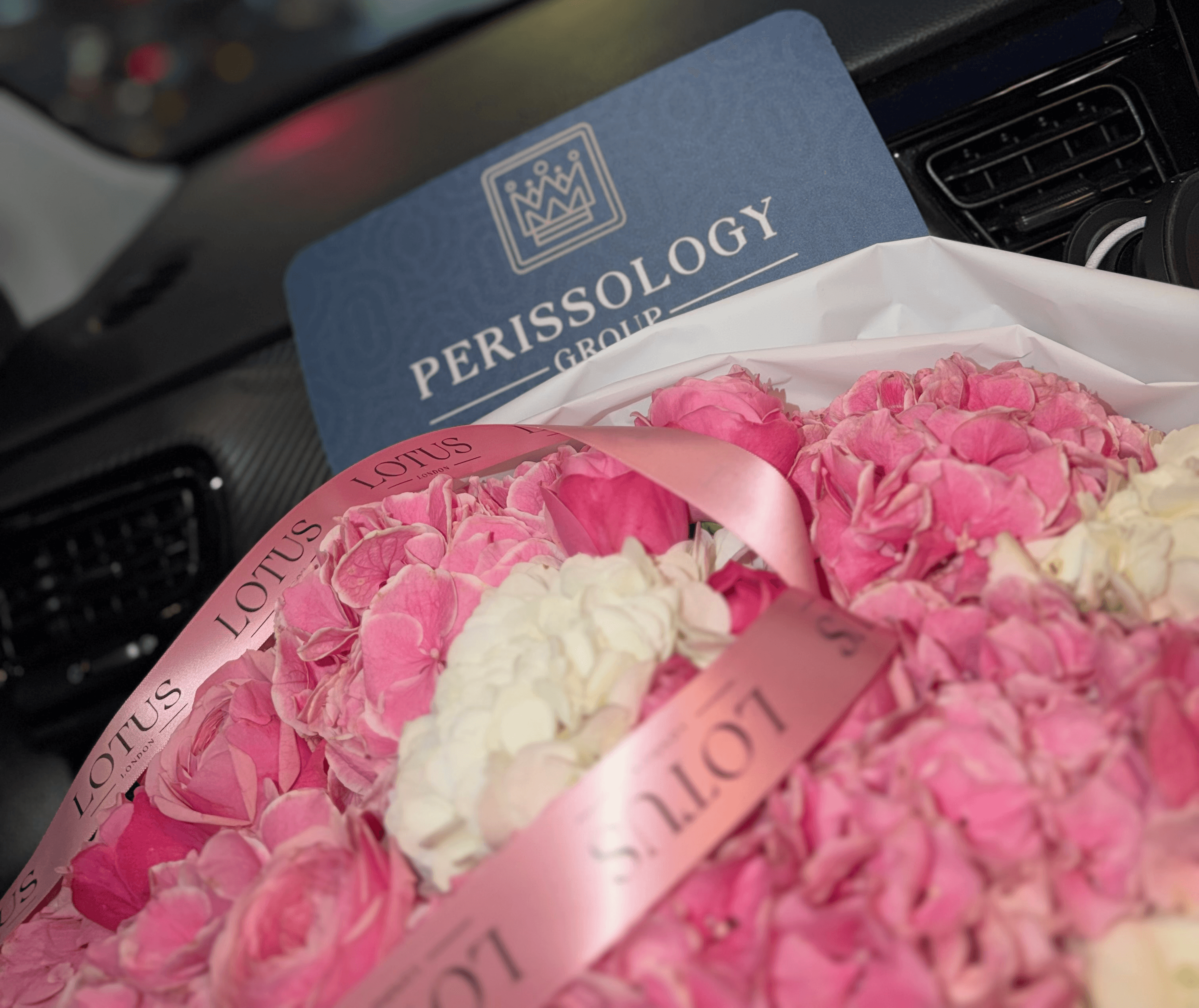 Perissology delivering a very large bunch of flowers