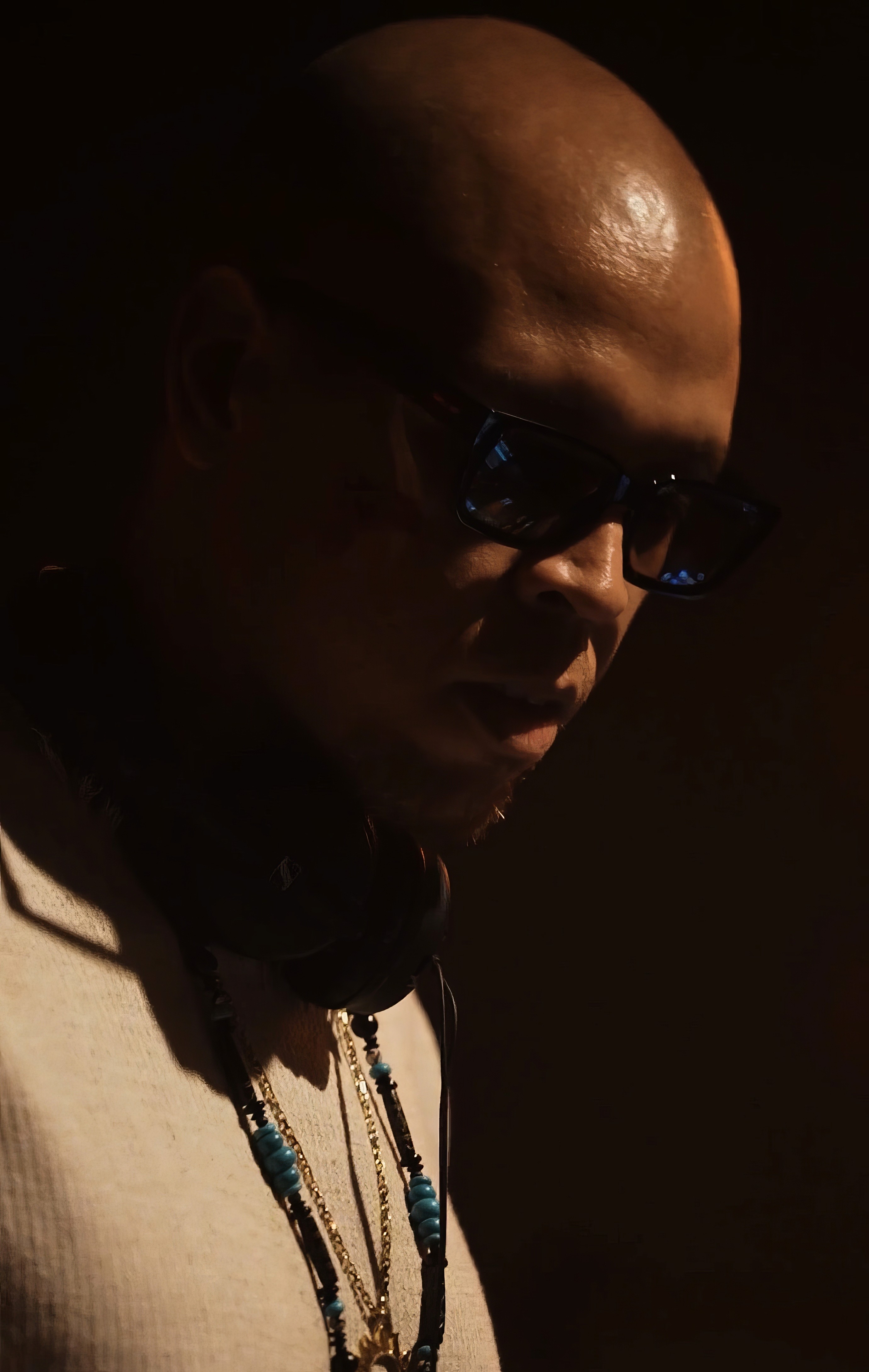 Bride in white dress walking on street, man in background