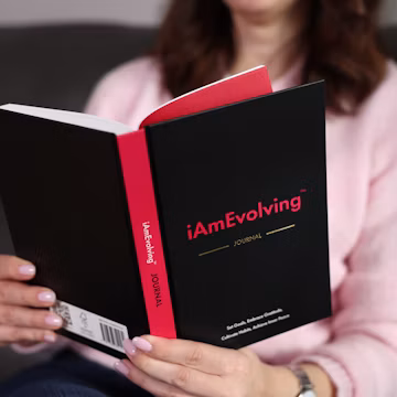 Woman reading a book with red accents