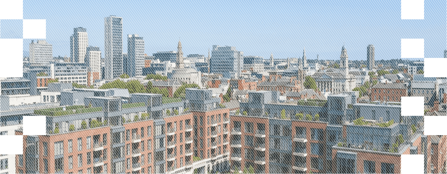 A panoramic view of modern city buildings, blending brick and glass architecture under a clear blue sky.
