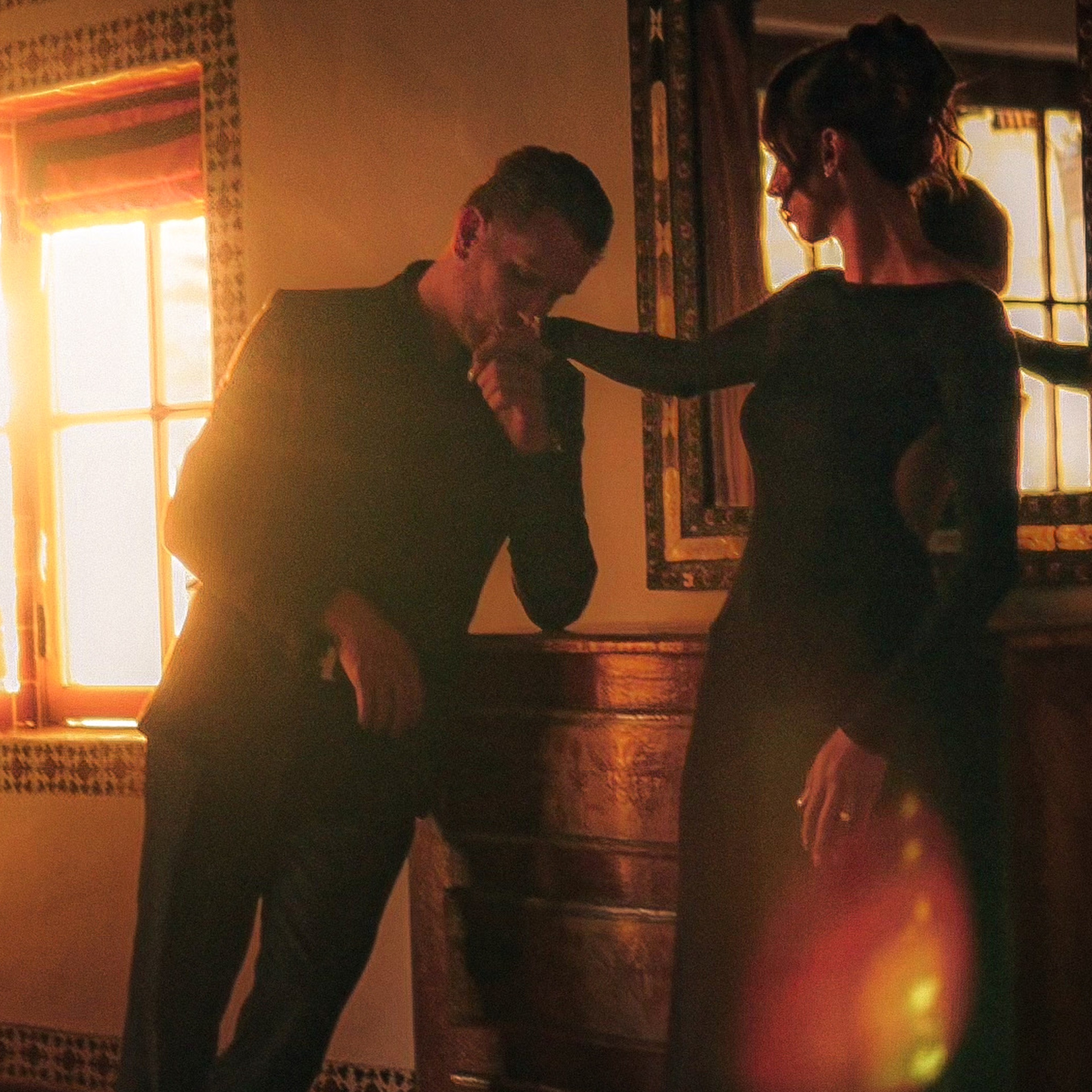 man and woman dancing wearing casual dresses