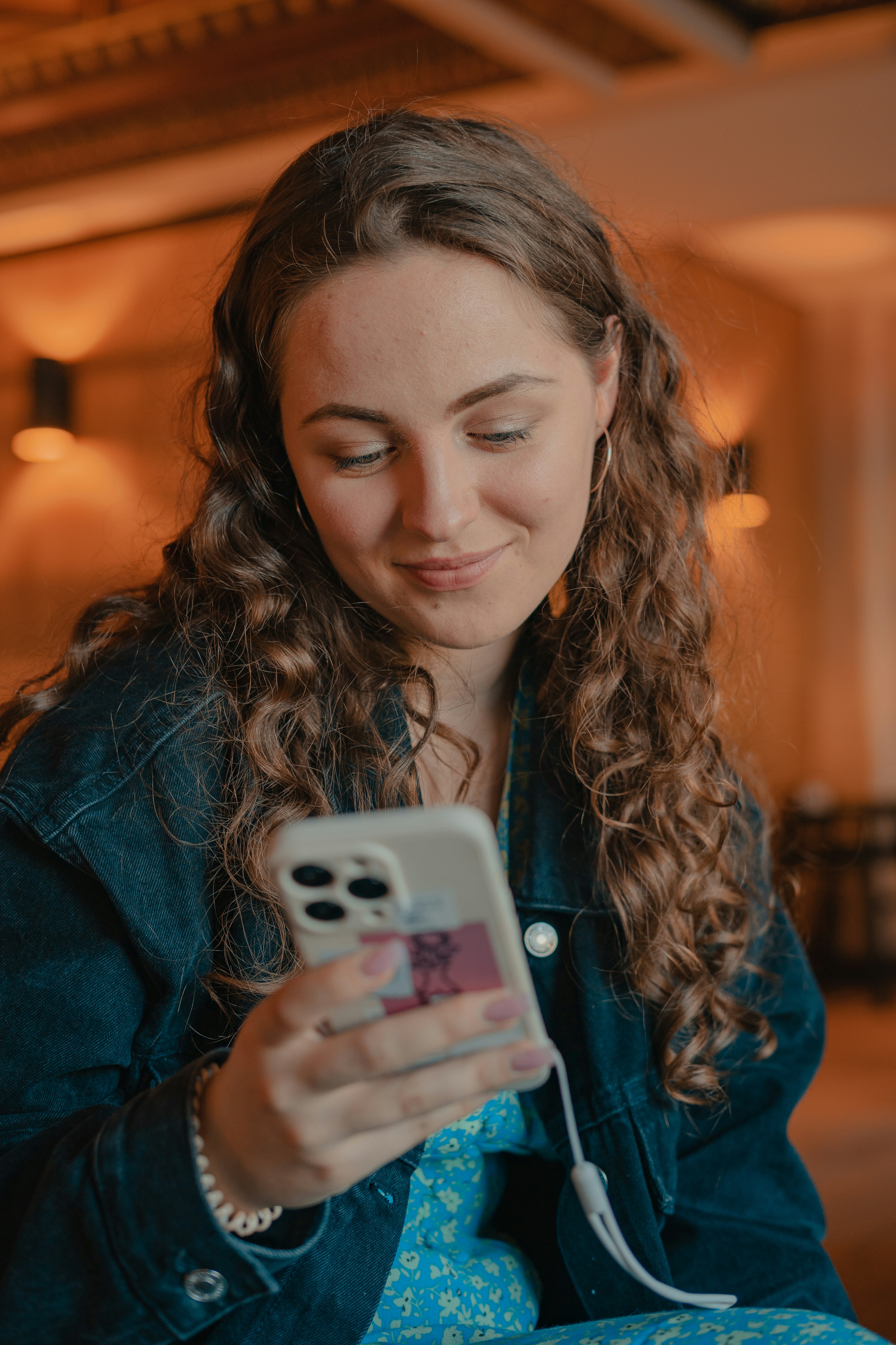 a woman holding a phone
