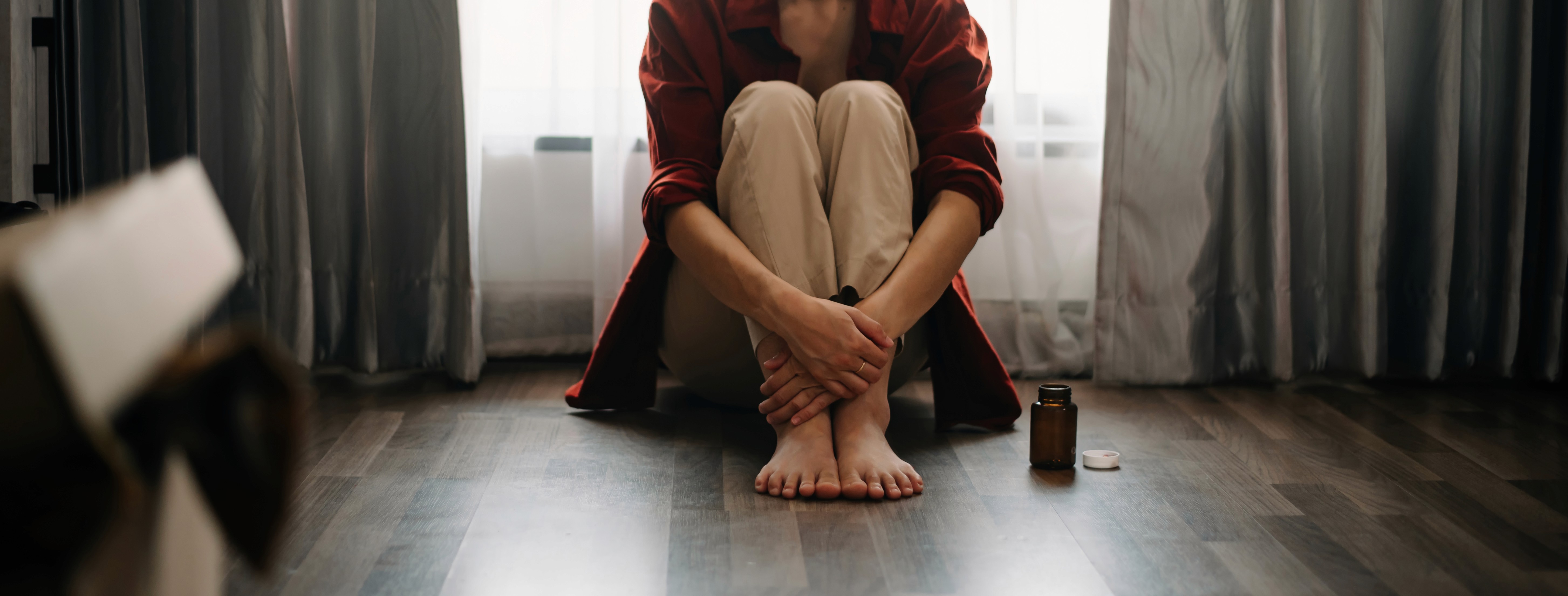 man wearing gray polo shirt beside dry-erase board