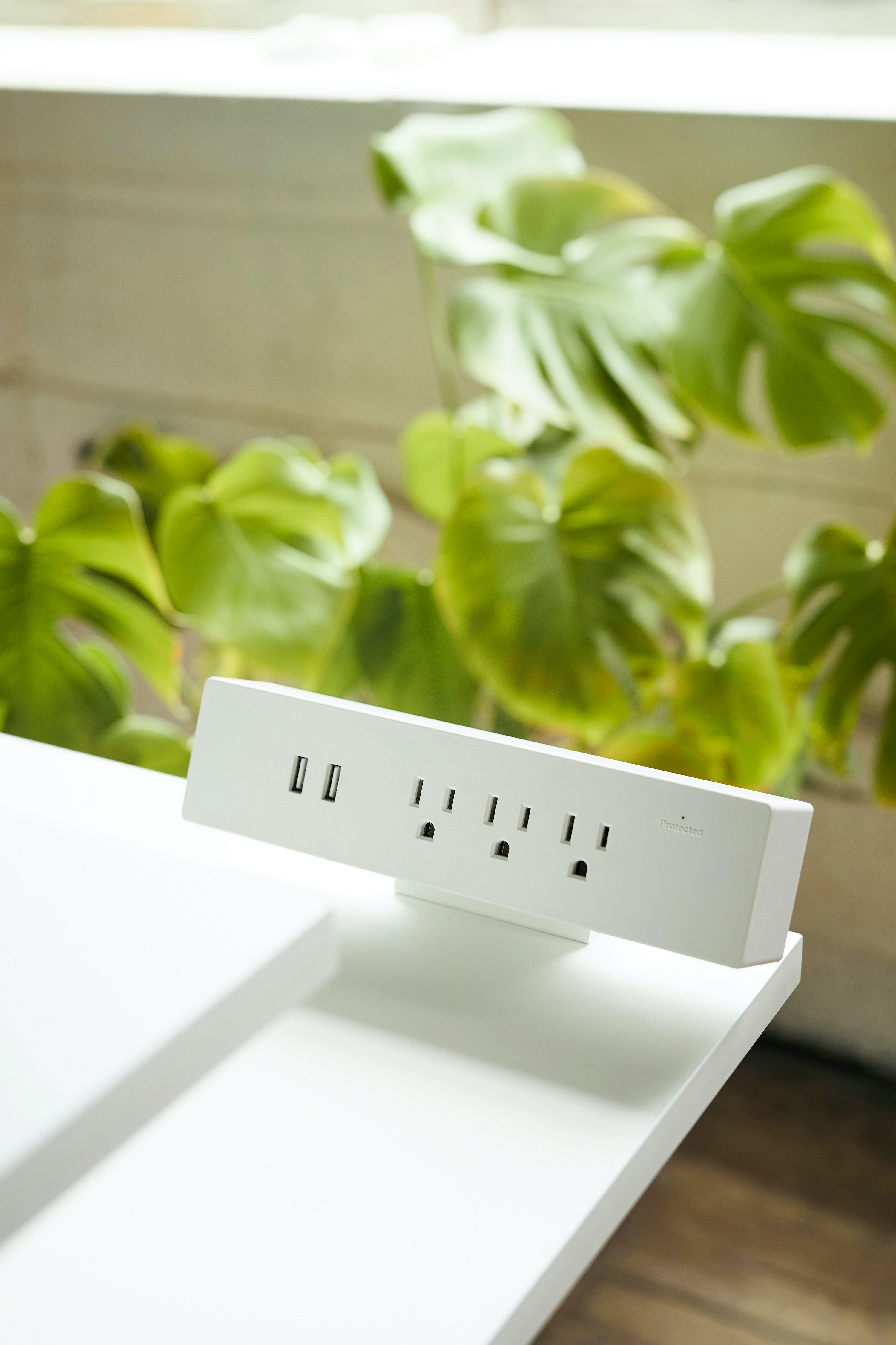 Home office with a wooden desk, monitor, and natural light—ideal setting for hosts or cohosts managing direct bookings and growing their short-term rental brand online. | Animate UX