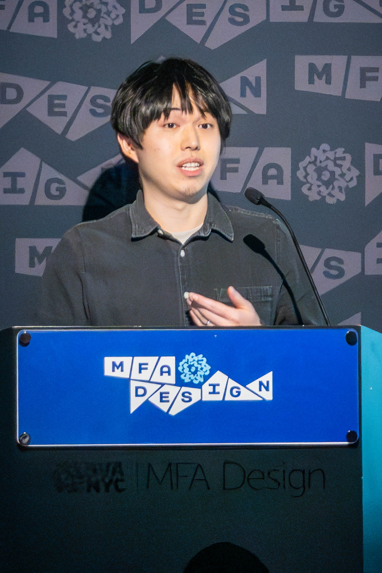 student at a podium giving a presentation
