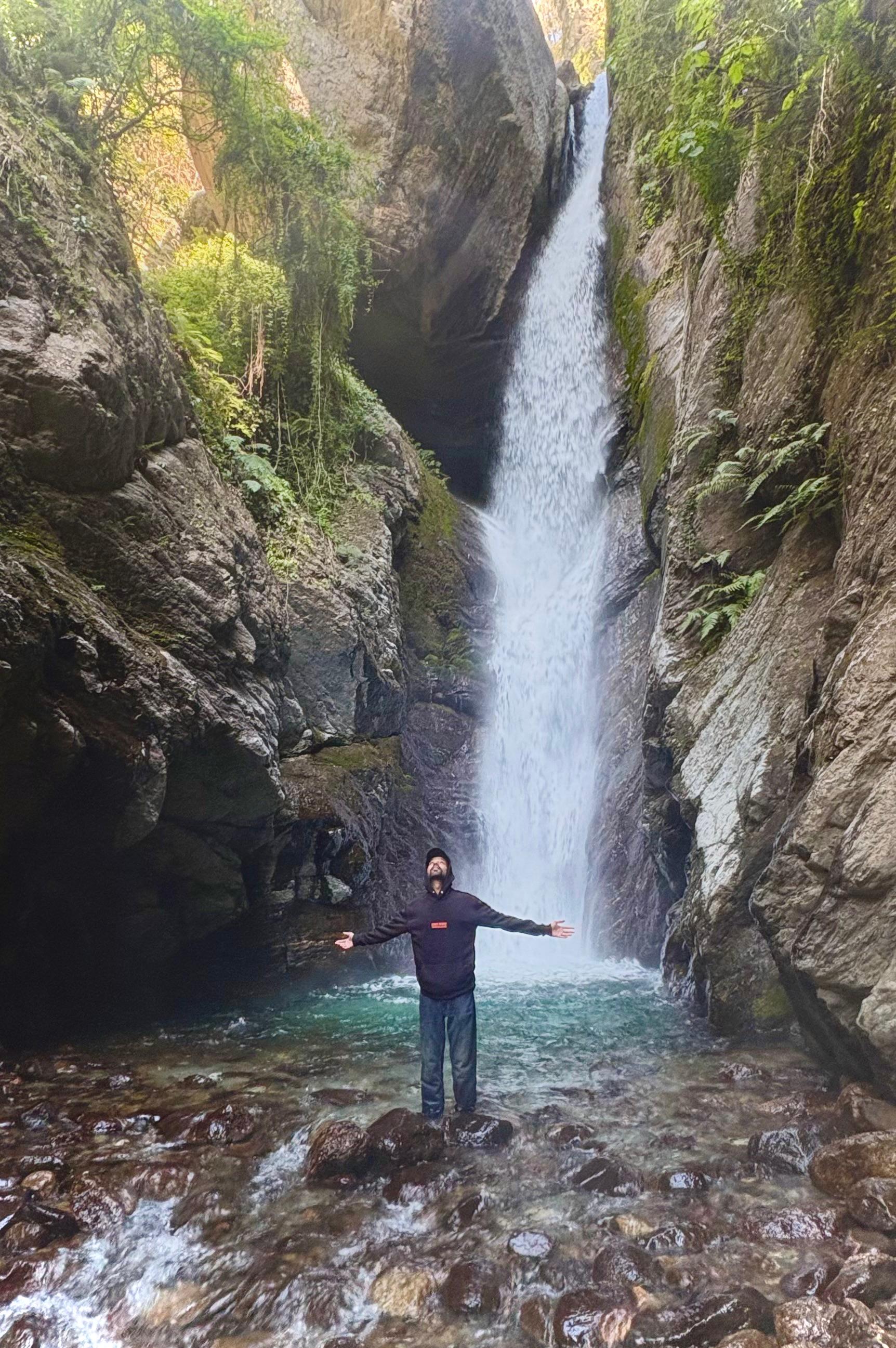 a blurry photo of a person standing in front of a wall
