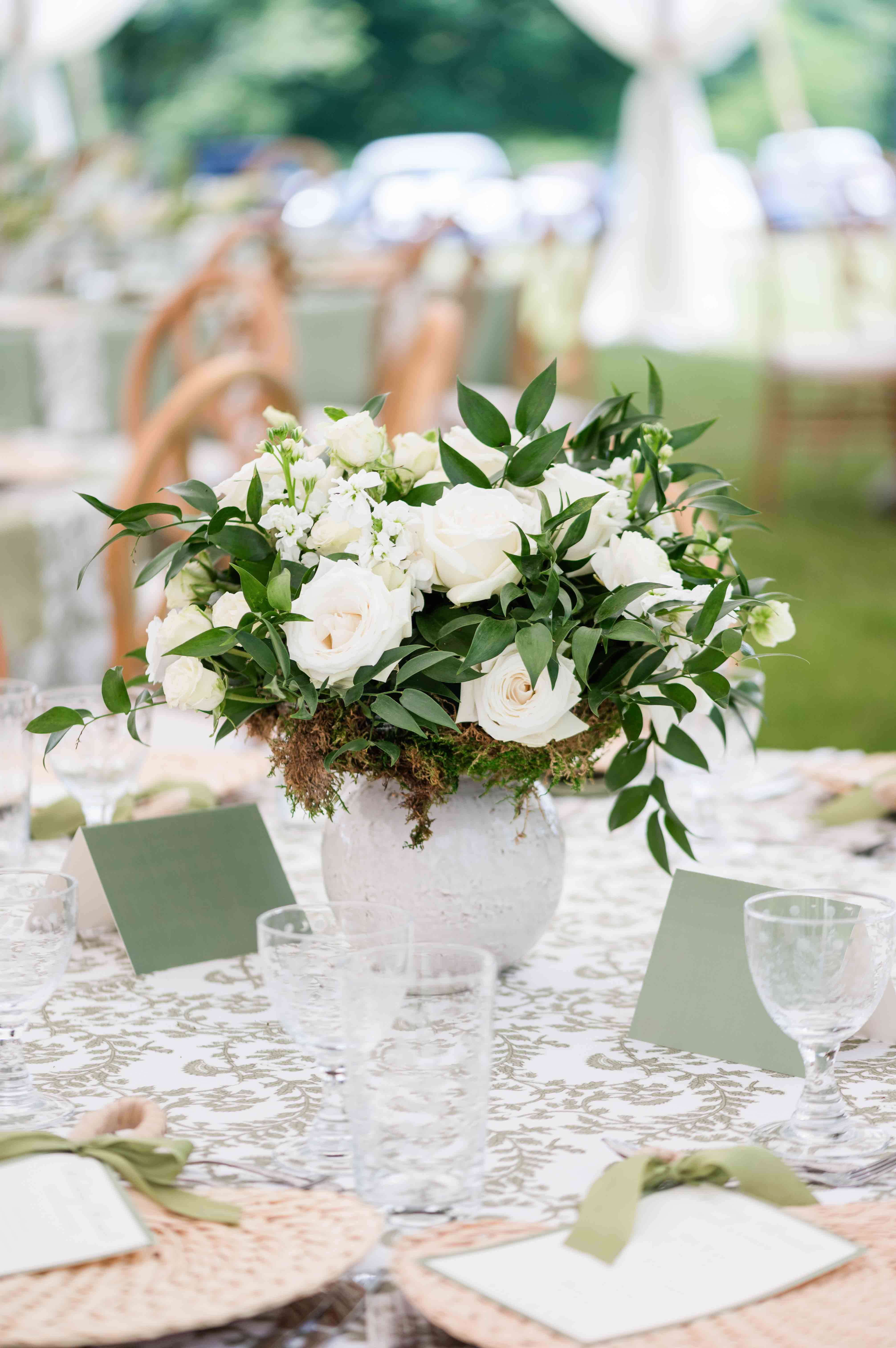 Floral arrangement for a wedding outside on a sumemr day.