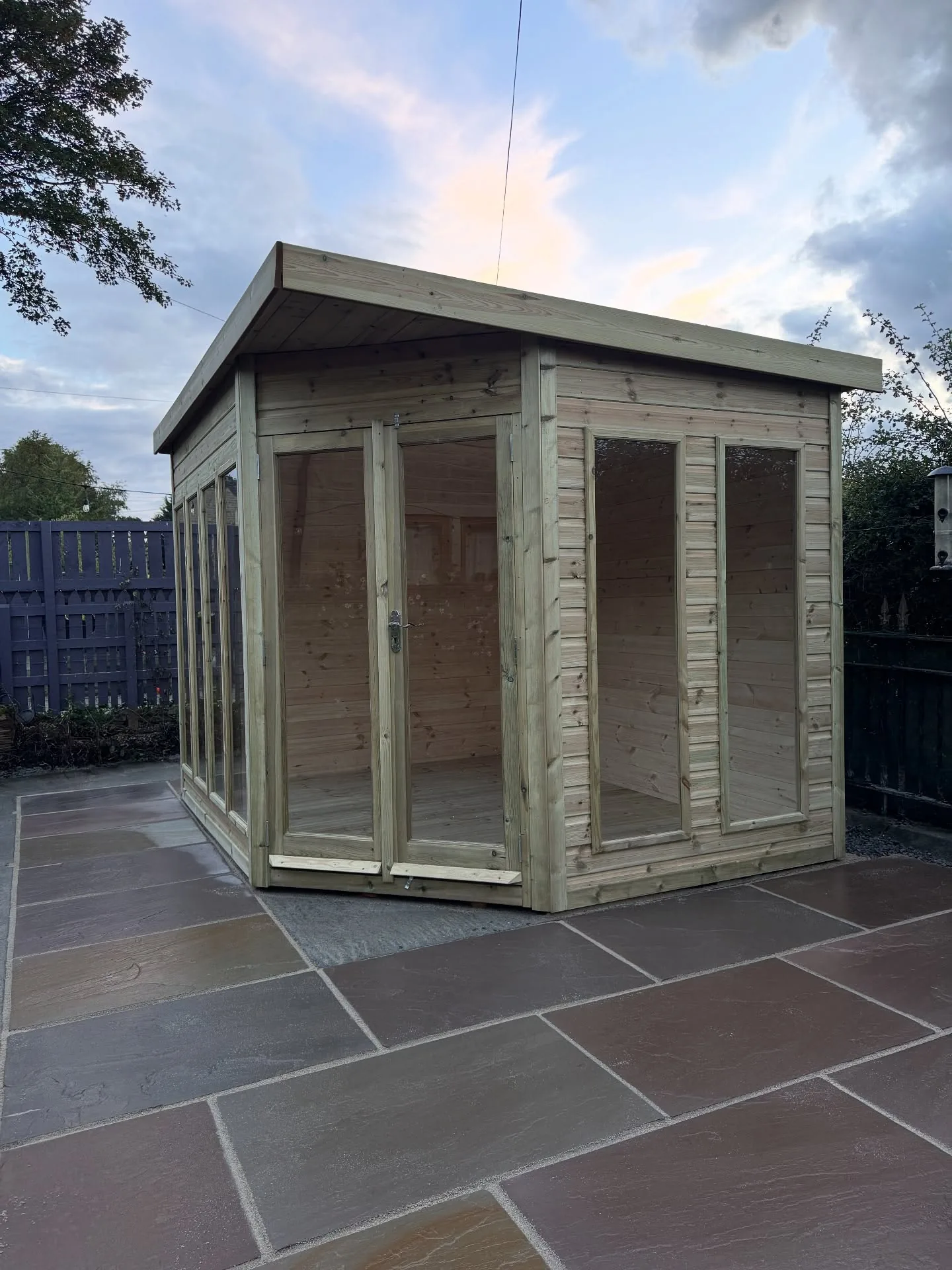 Finished timber summer house with Indian stone patio in Todmorden