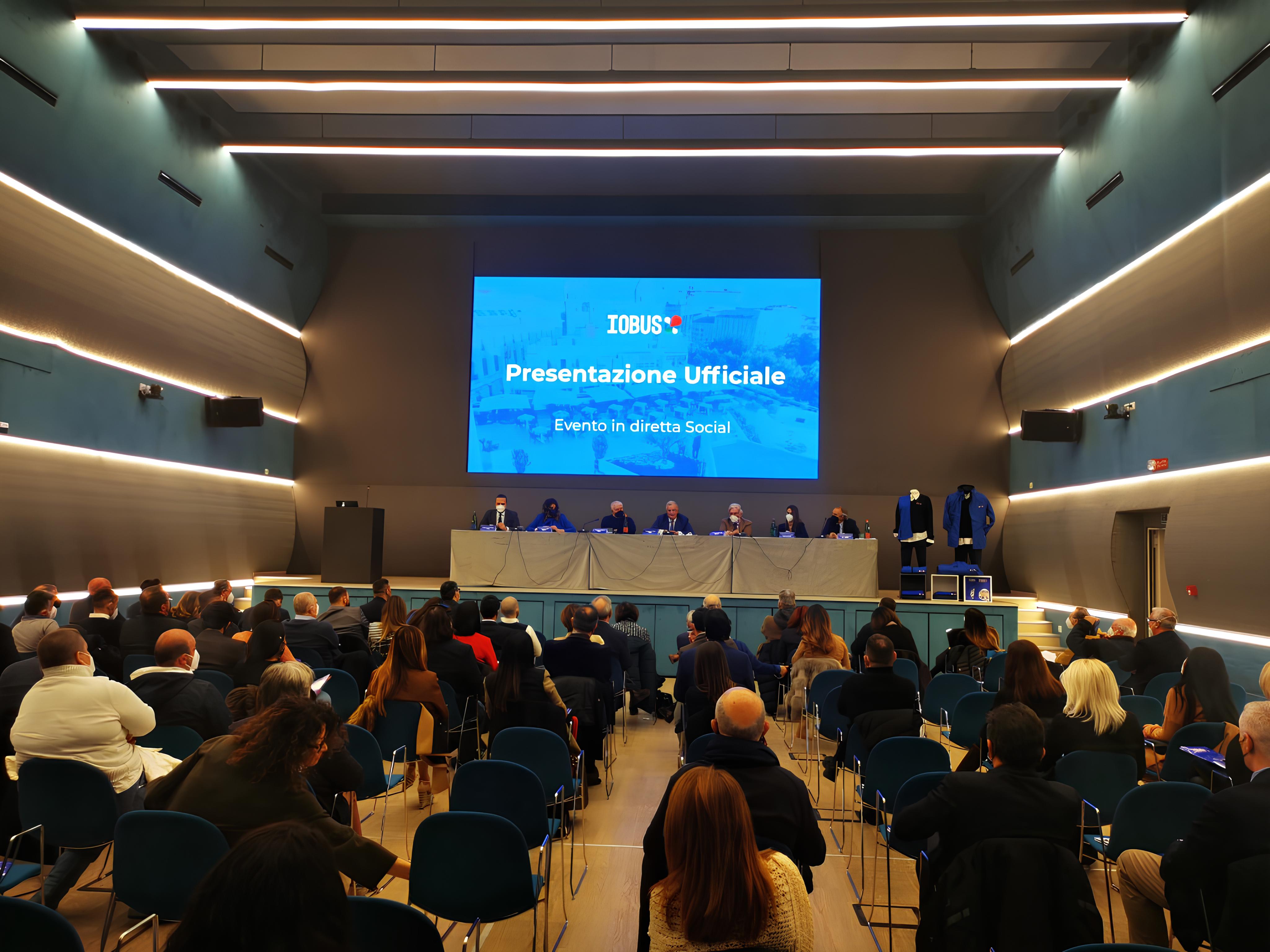 man standing near cliff looking at body of water during daytime