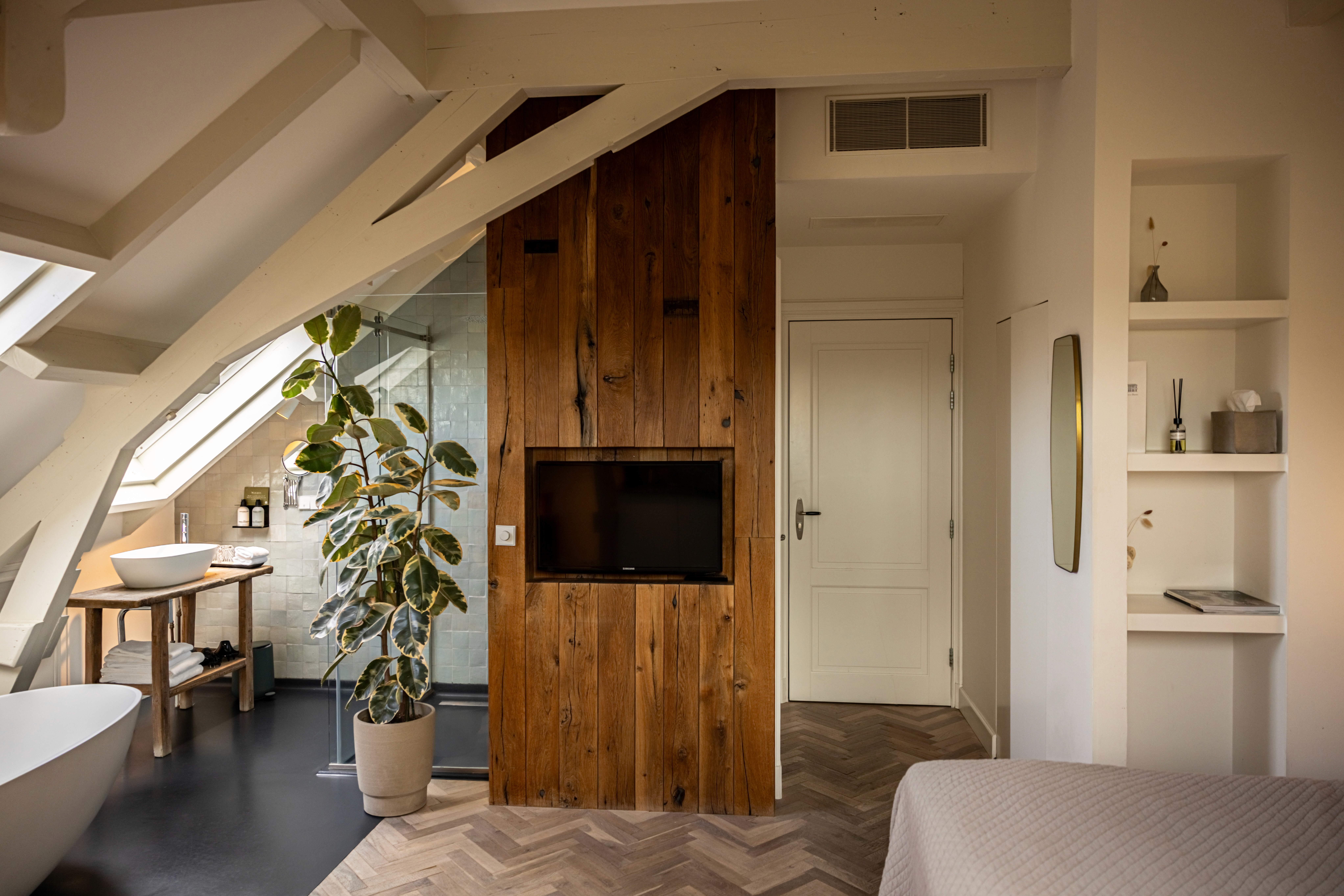 man's hand pouring red wint into a glass