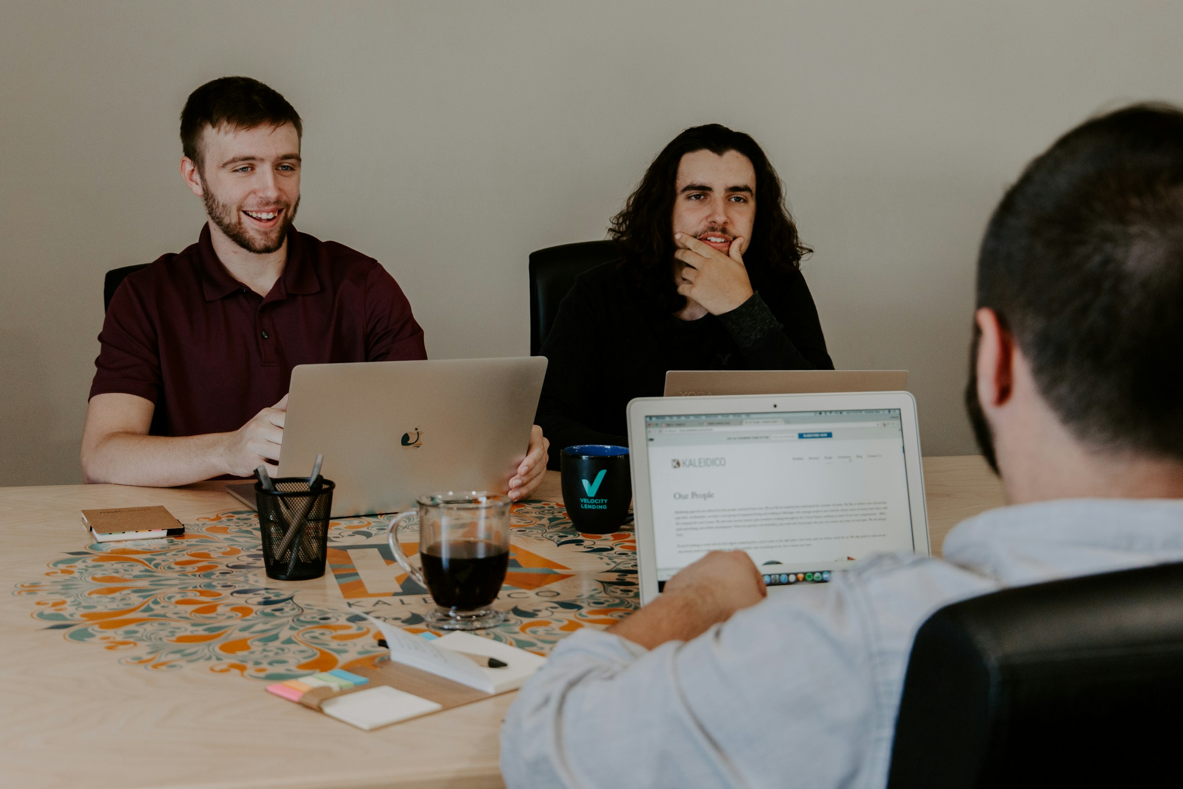 person in discussion with team - How to Cite a Book