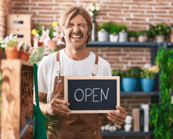 The flower shop owner smiling