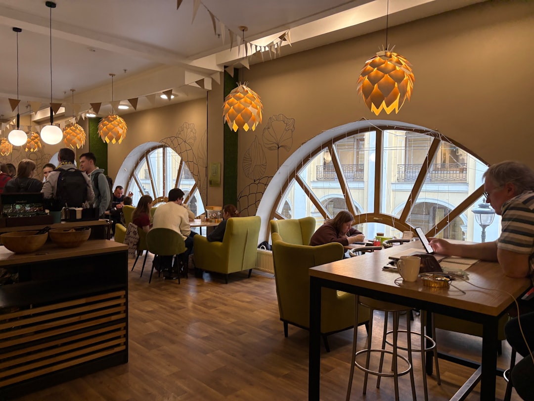 A group of people sitting at a table in a restaurant