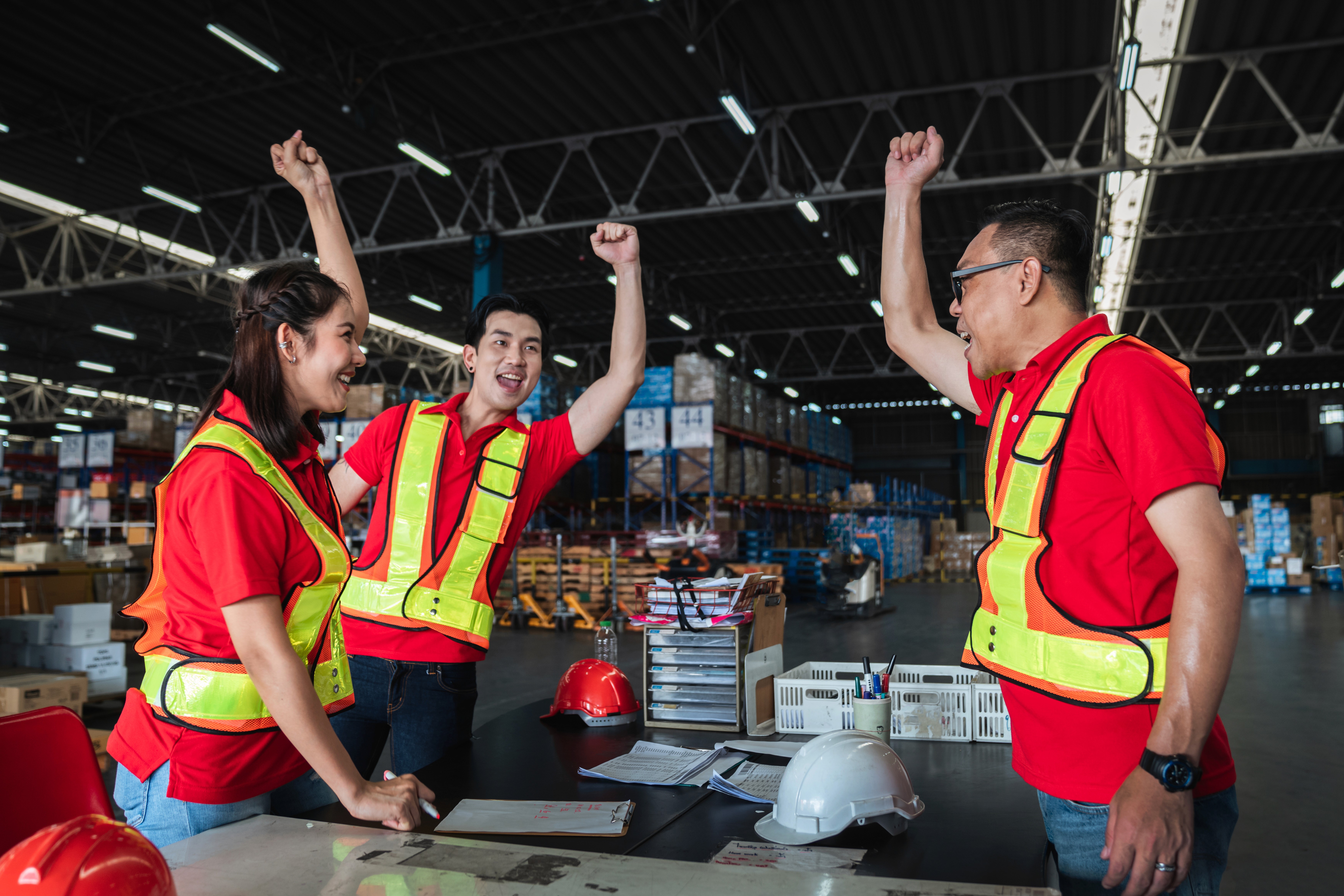 Two men and lady packaging boxes