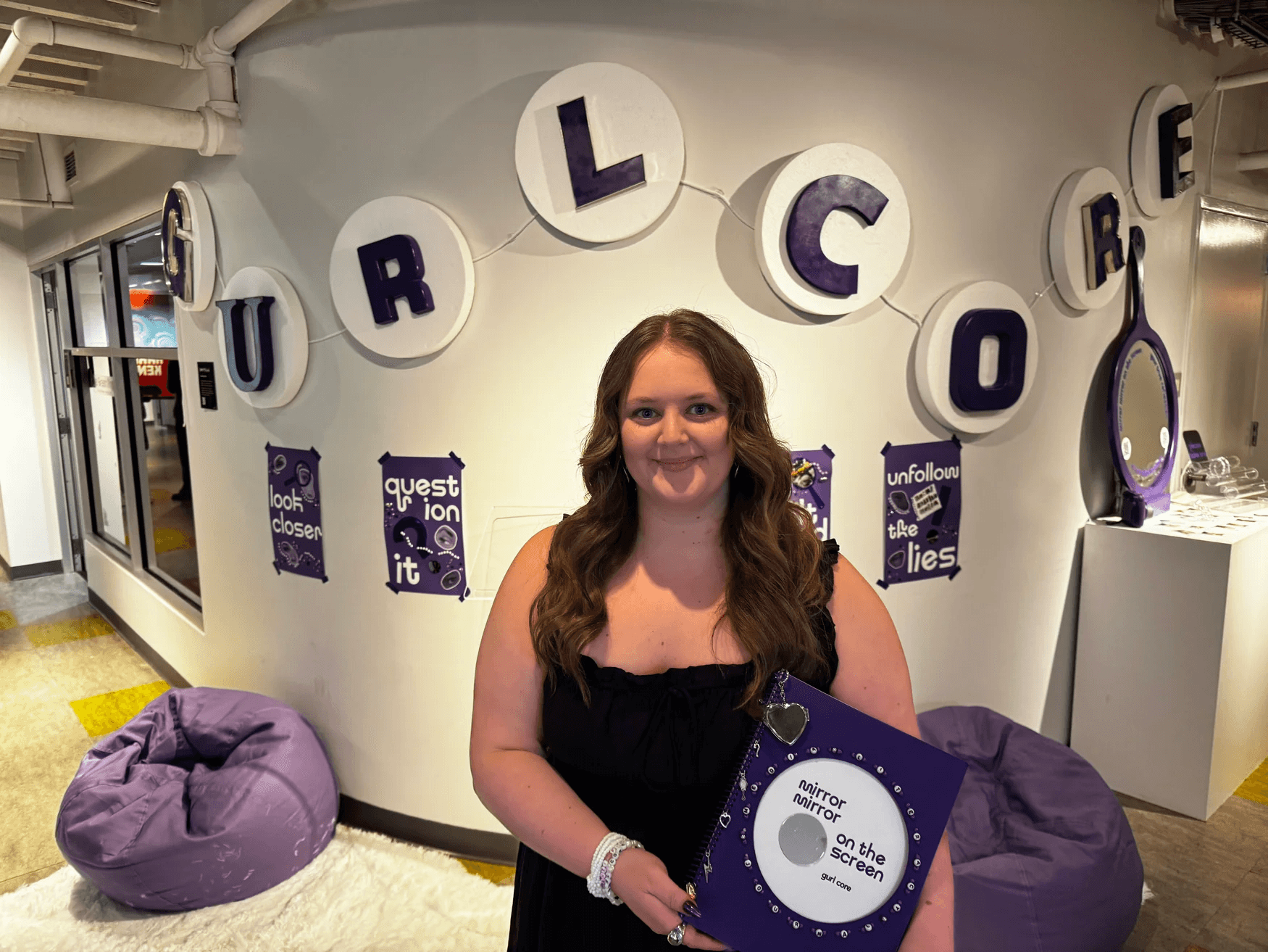 Caroline Schwarm holding a gurl core journal