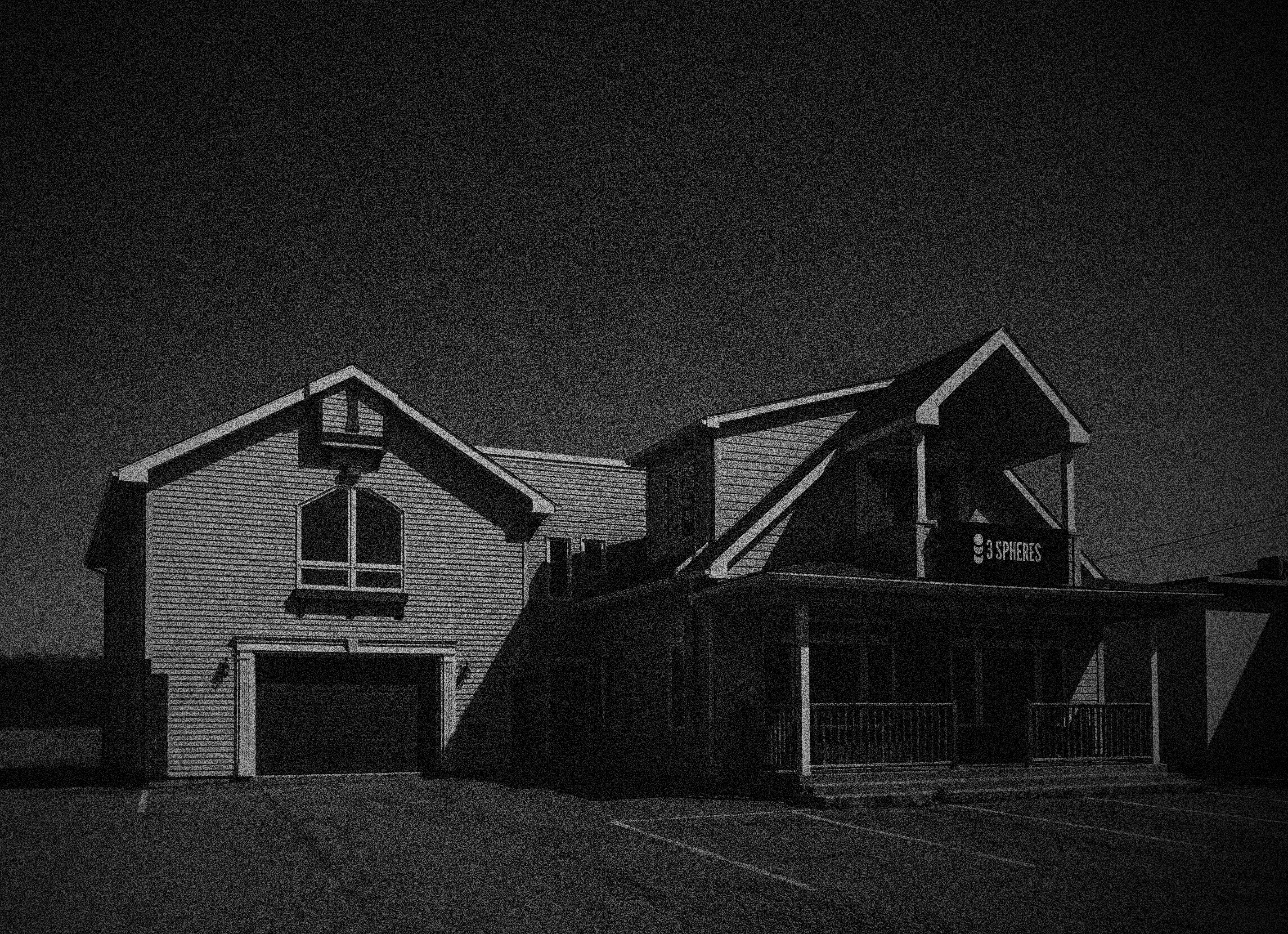  Collaborative work session overhead view of six people collaborating at a rustic wooden table with coffee, papers, and a laptop