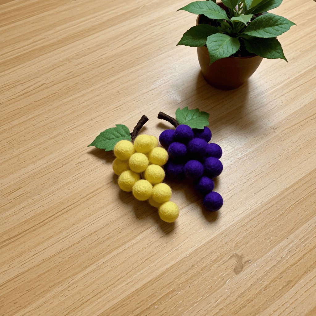 product photography of a pair of grape shapes