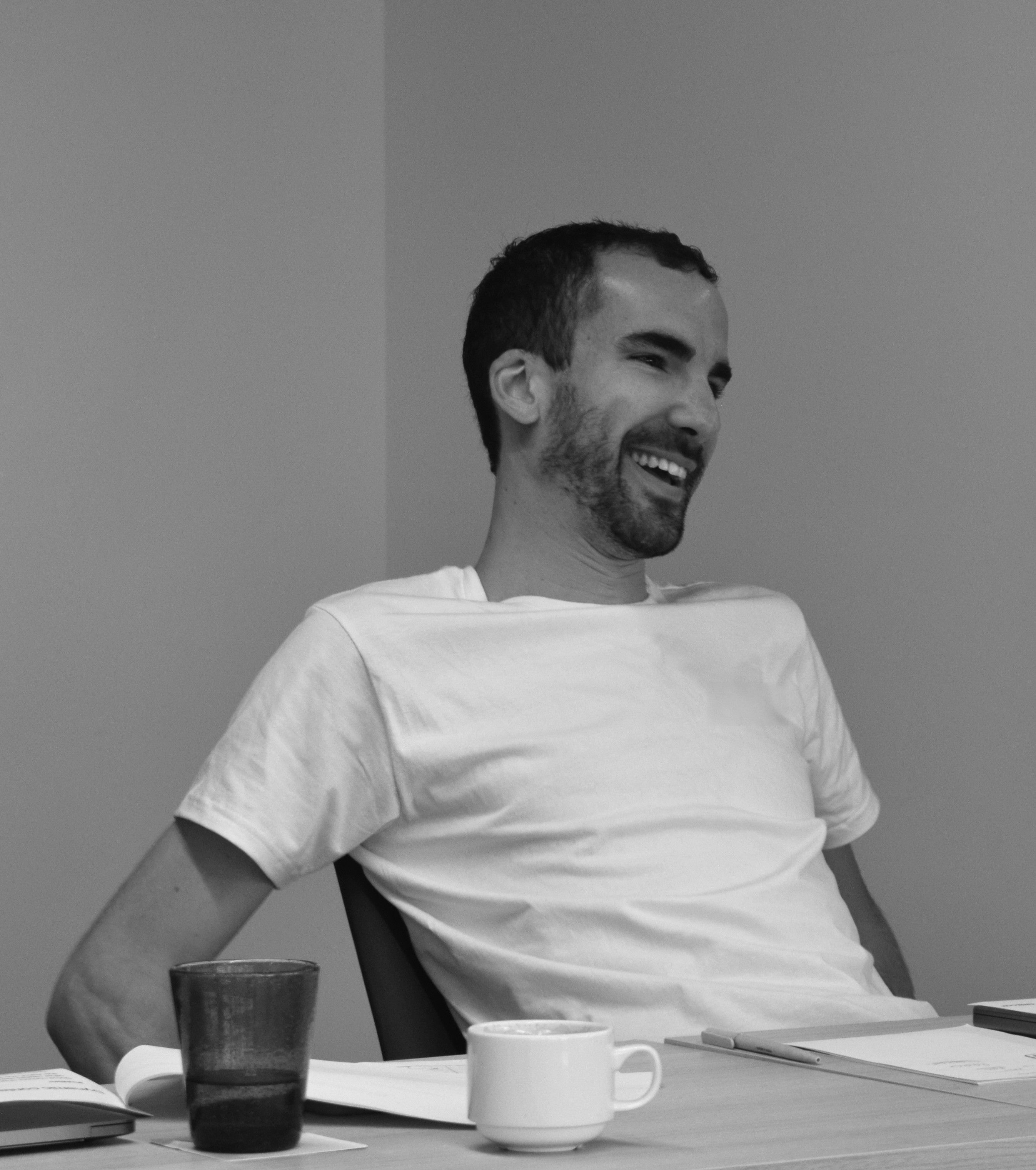A selfie showing four members of the GitBook team at the top of a hill overlooking Port de Sóller in Majorca during an offsite