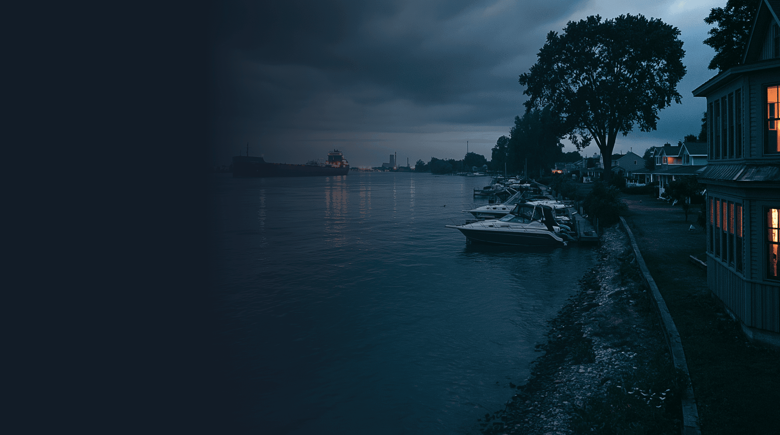 St. Clair River at dusk with upbound freighter