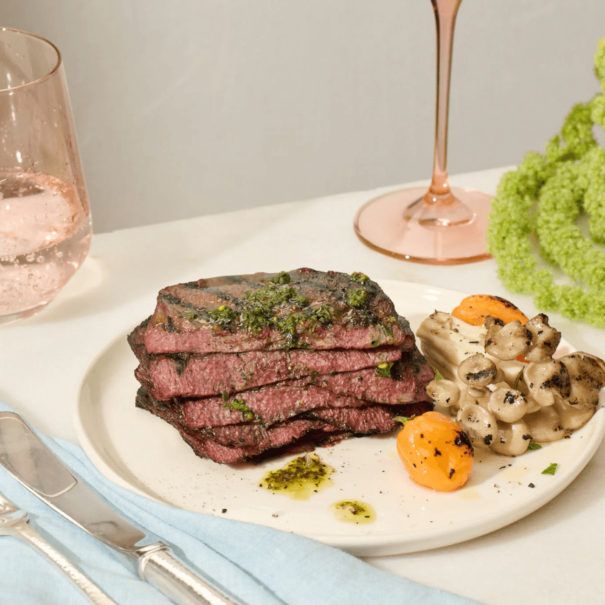 A plate with stake and vegetables.