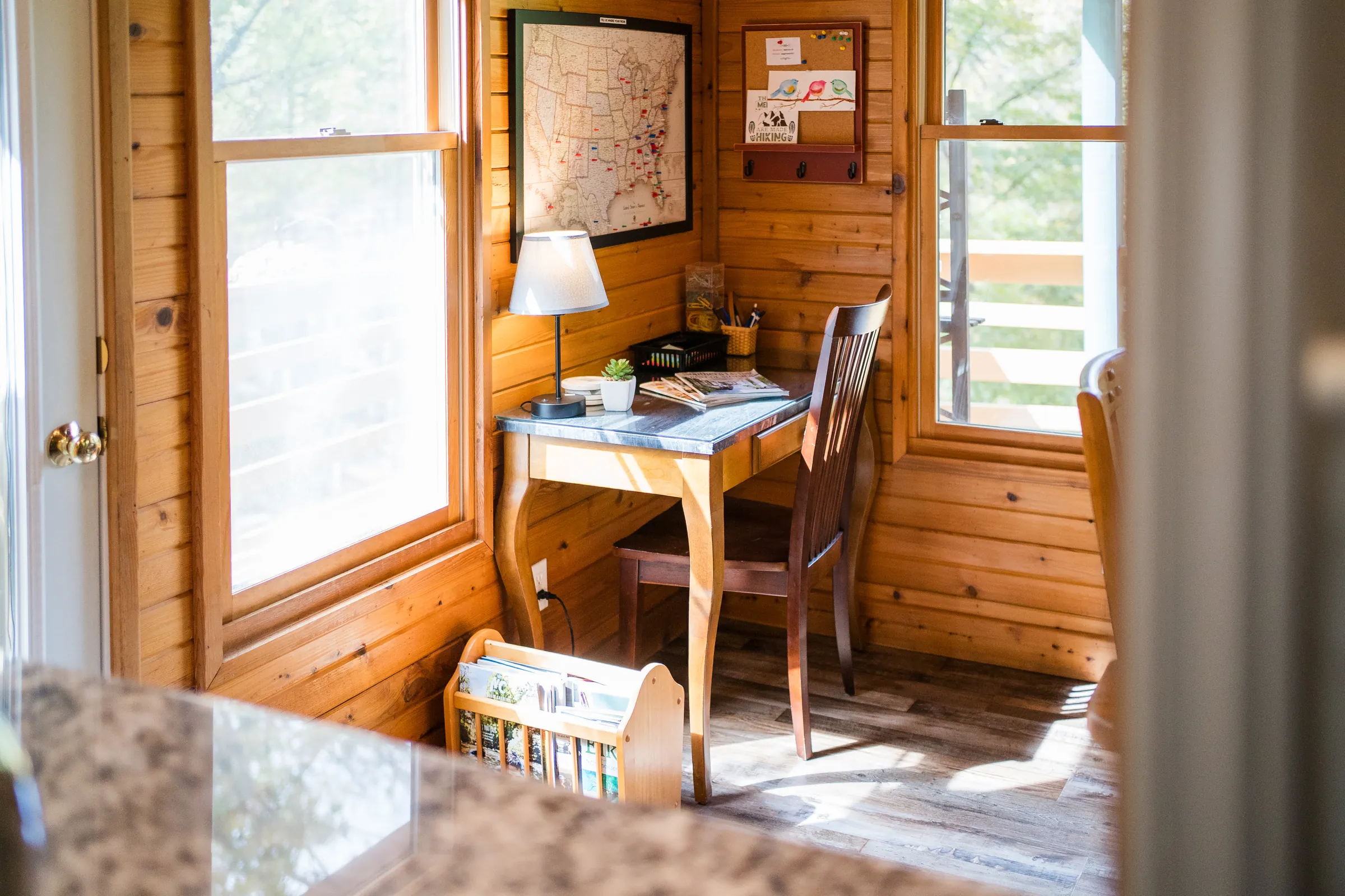 Bella Vita work nook with a desk, map and window