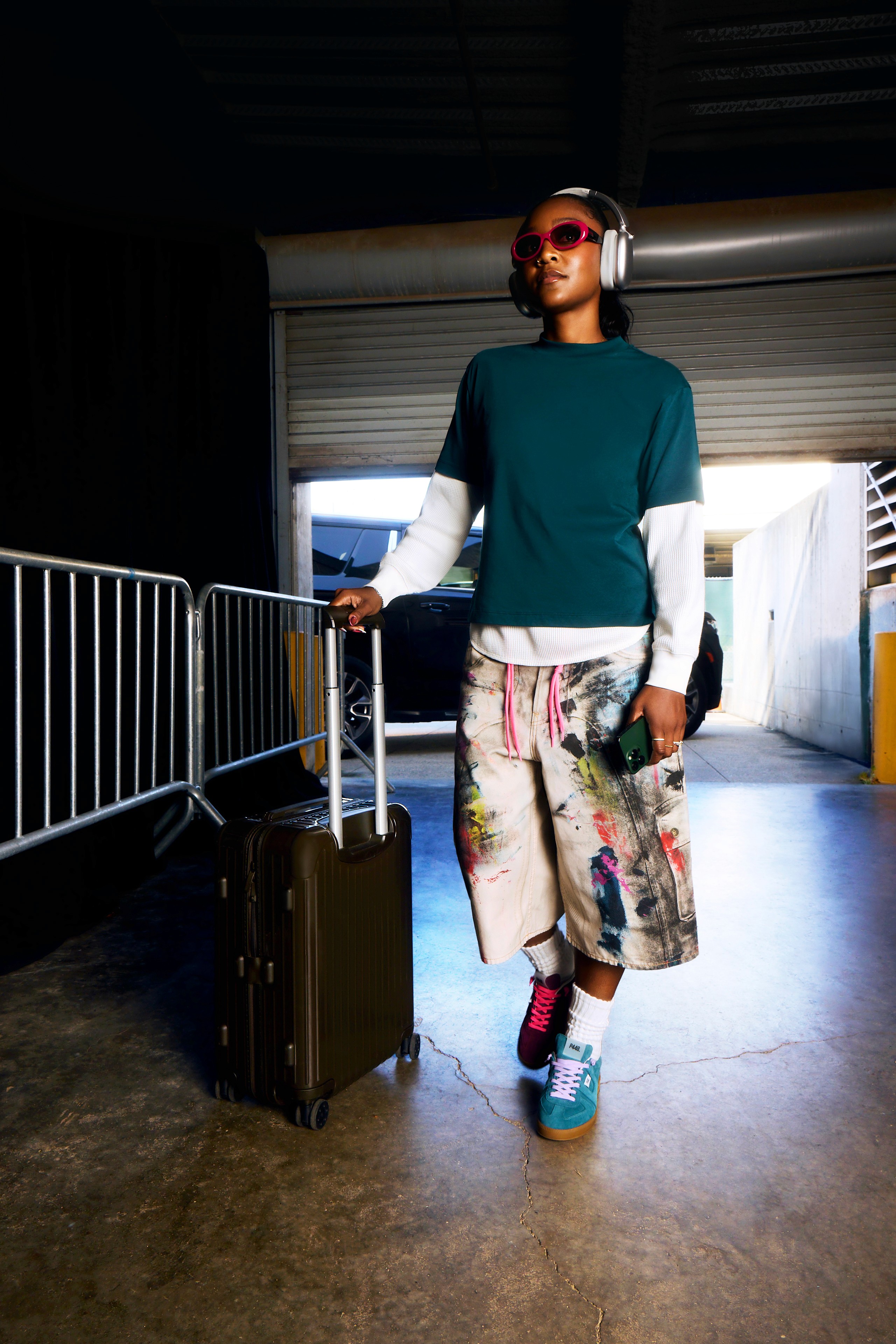 Snow-capped mountains viewed through a car window.