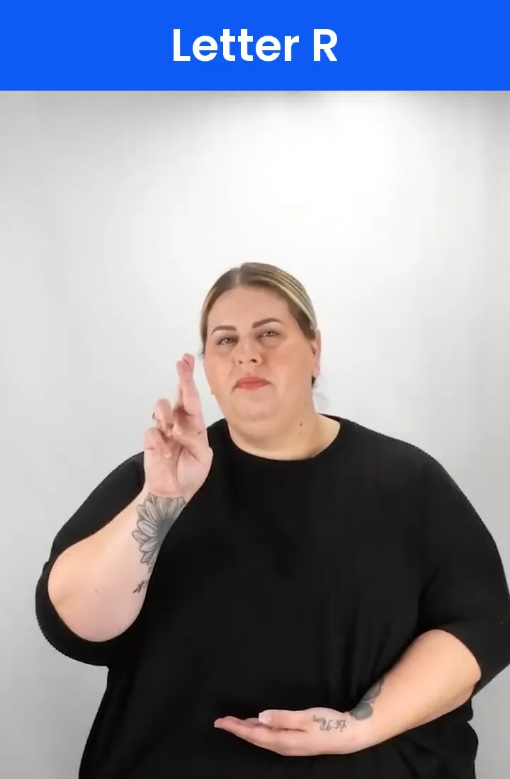 A Deaf signer signs R in ASL