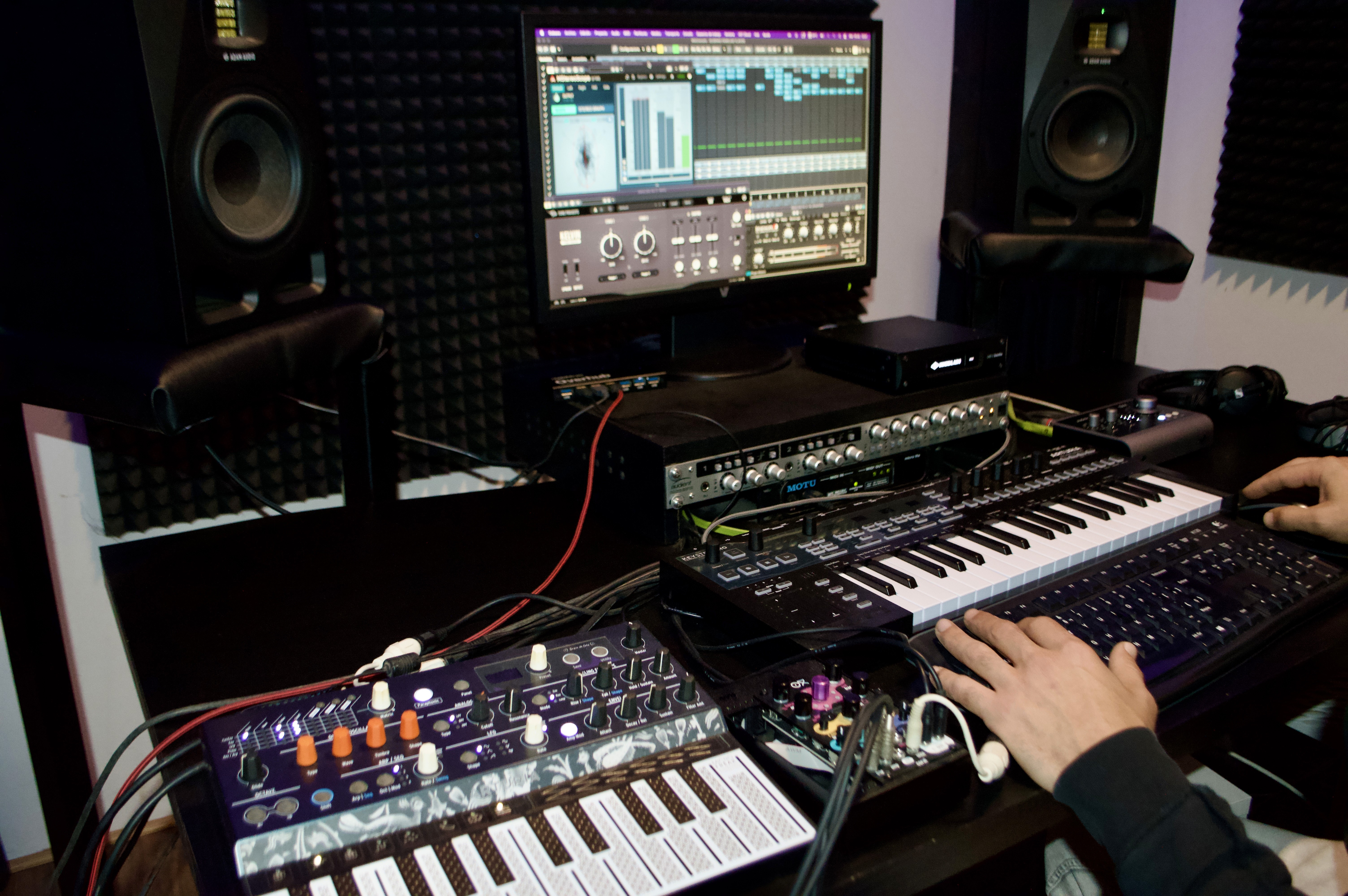 Music producer sitting on a chair in his studio