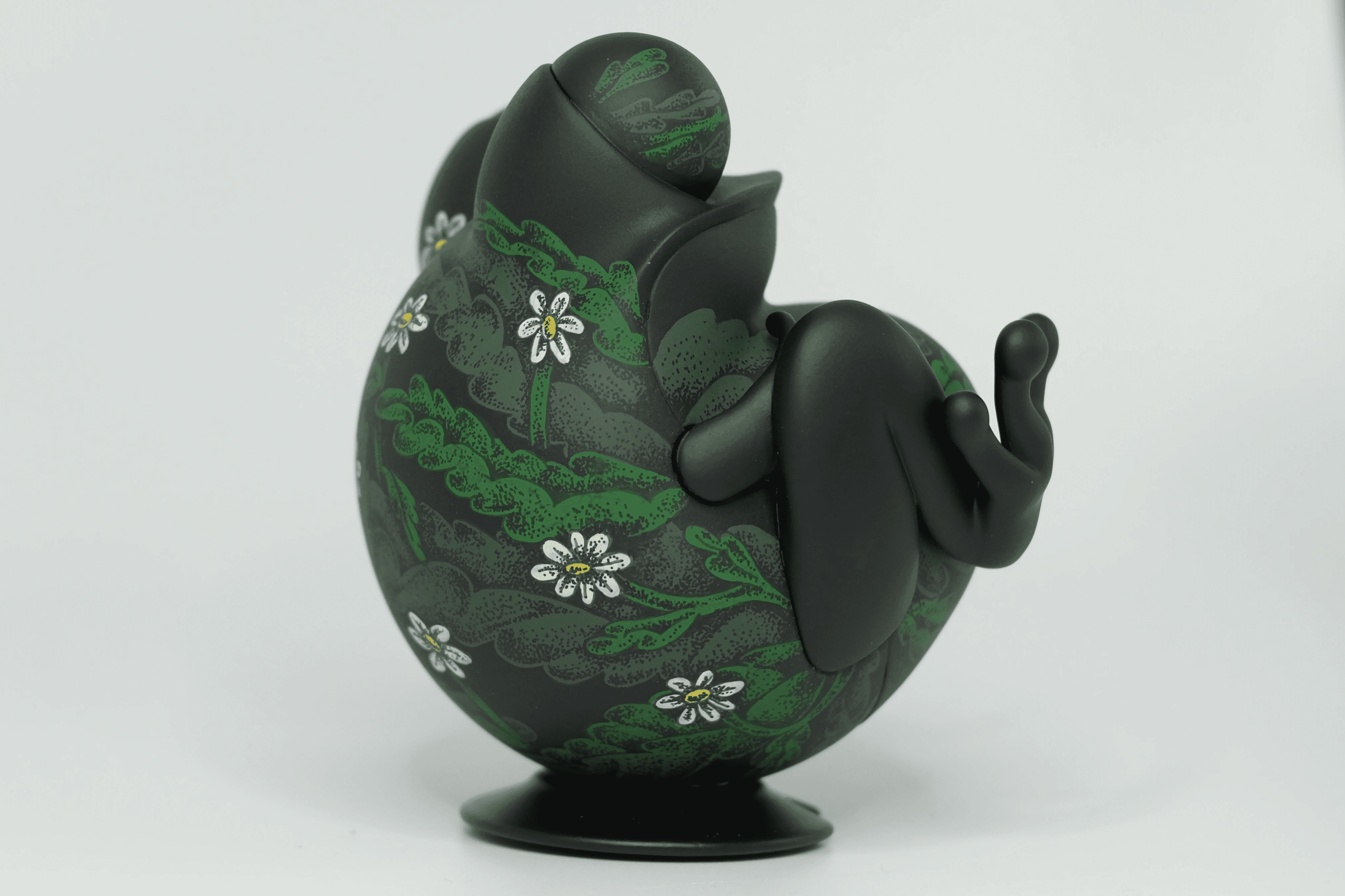 Close-up of Tegooroo frog figure's paw with pointillism dots