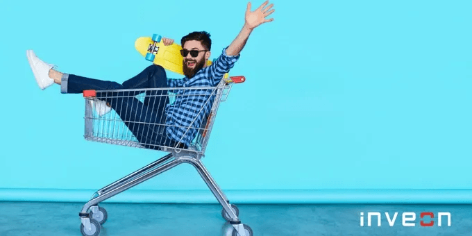 thumbnail image of a man sitting in a shopping cart looking energetic against a blue backdrop