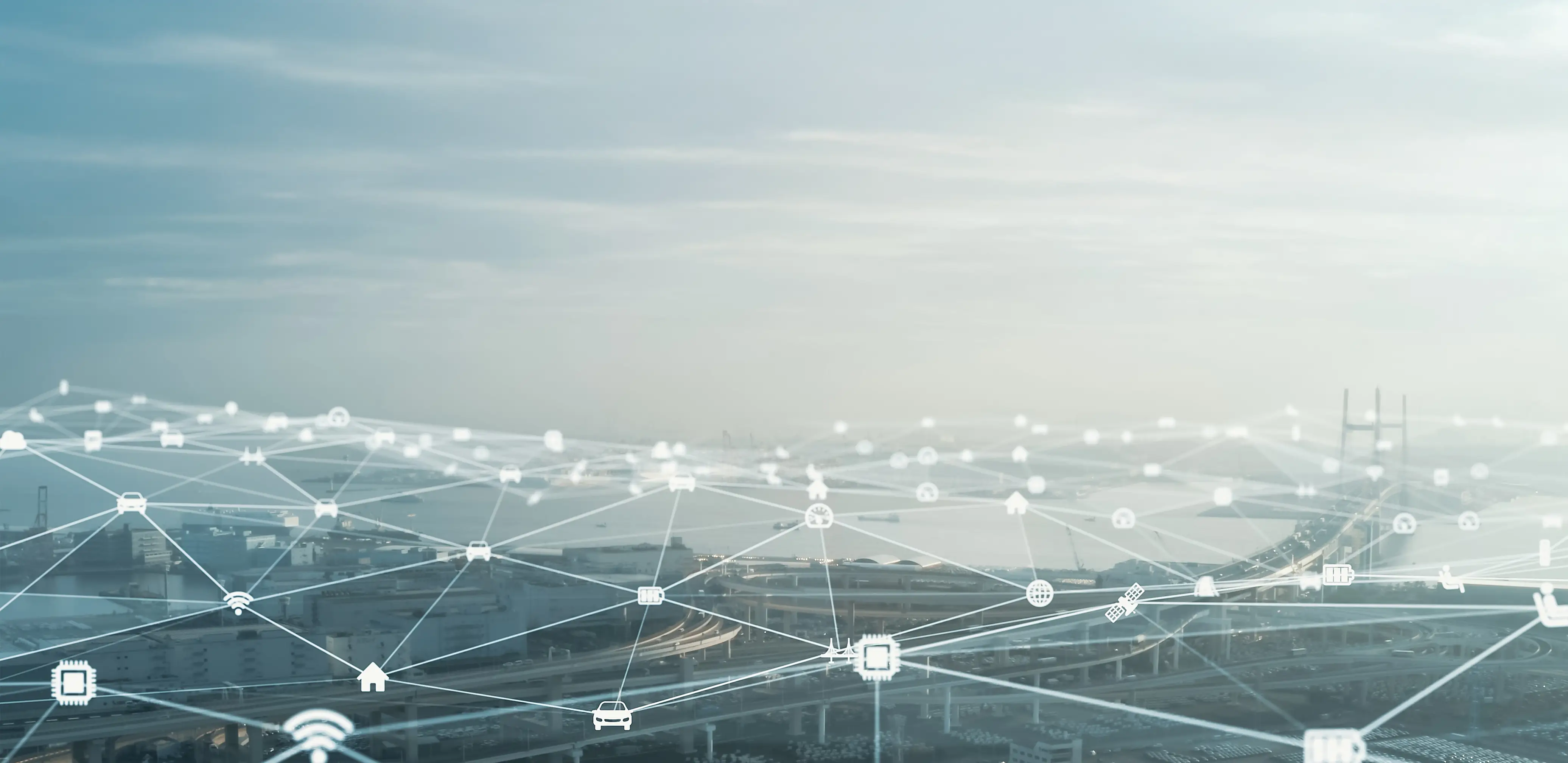 Digital network overlay across a landscape, symbolizing global IoT connectivity.