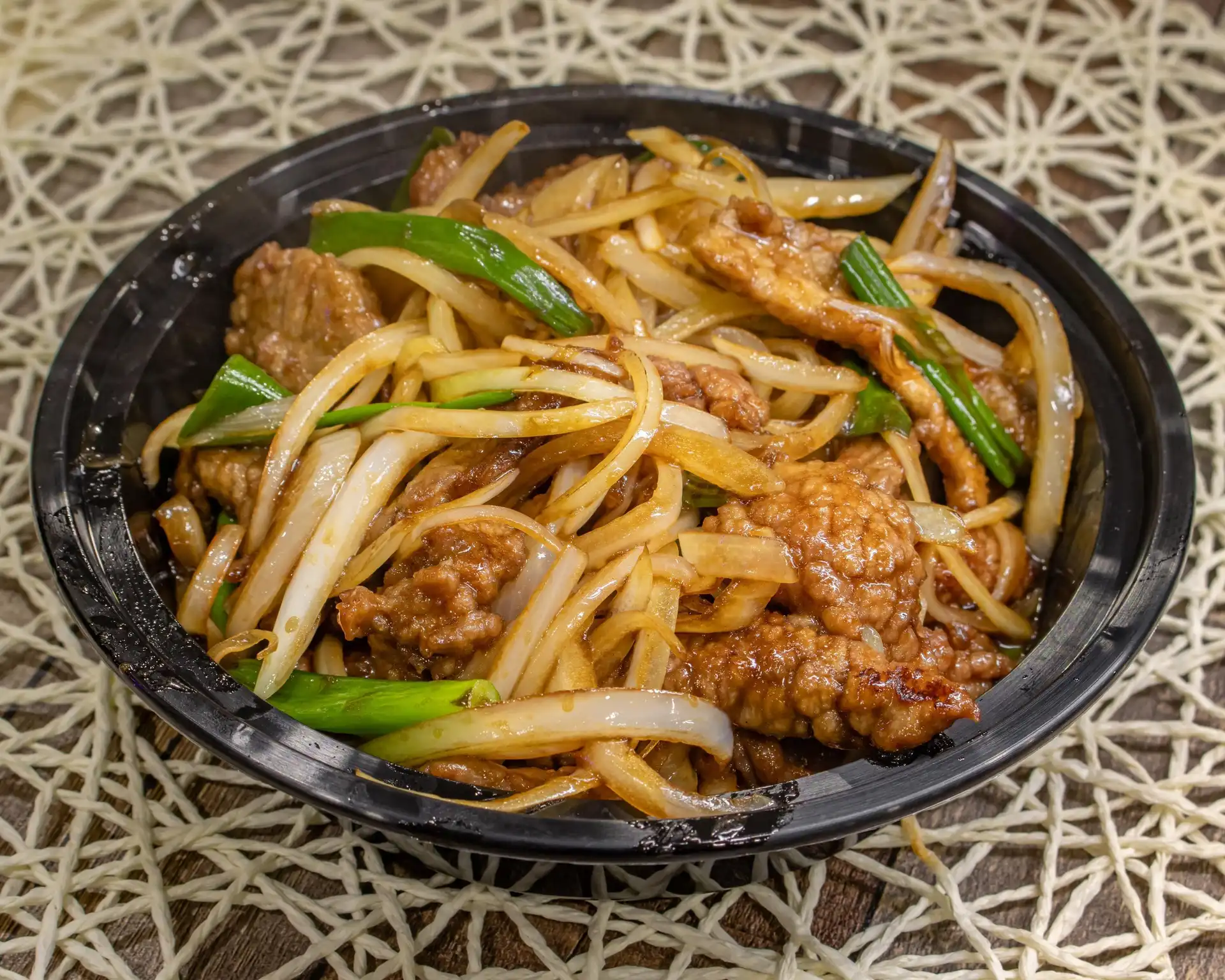 A beautifully arranged table with various dishes, fruits, and wine, evoking a warm dining atmosphere.