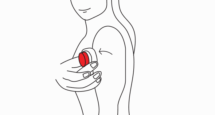 A line drawing of a person peeling the round red blood collection device off the side of their upper arm, lifting it from one side to the other.