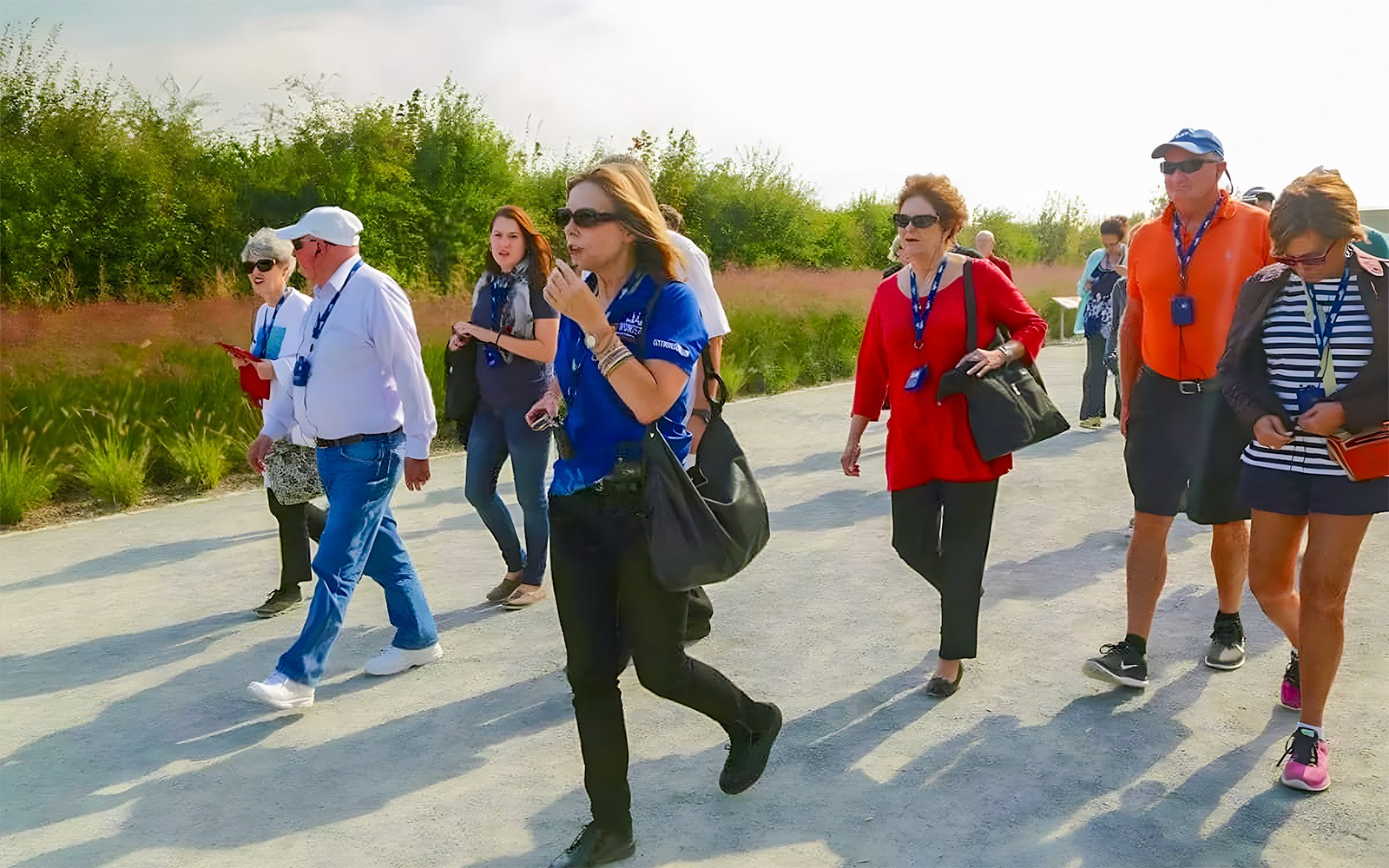 Tour group walking on a path during the D-Day Normandy Beaches guided tour.