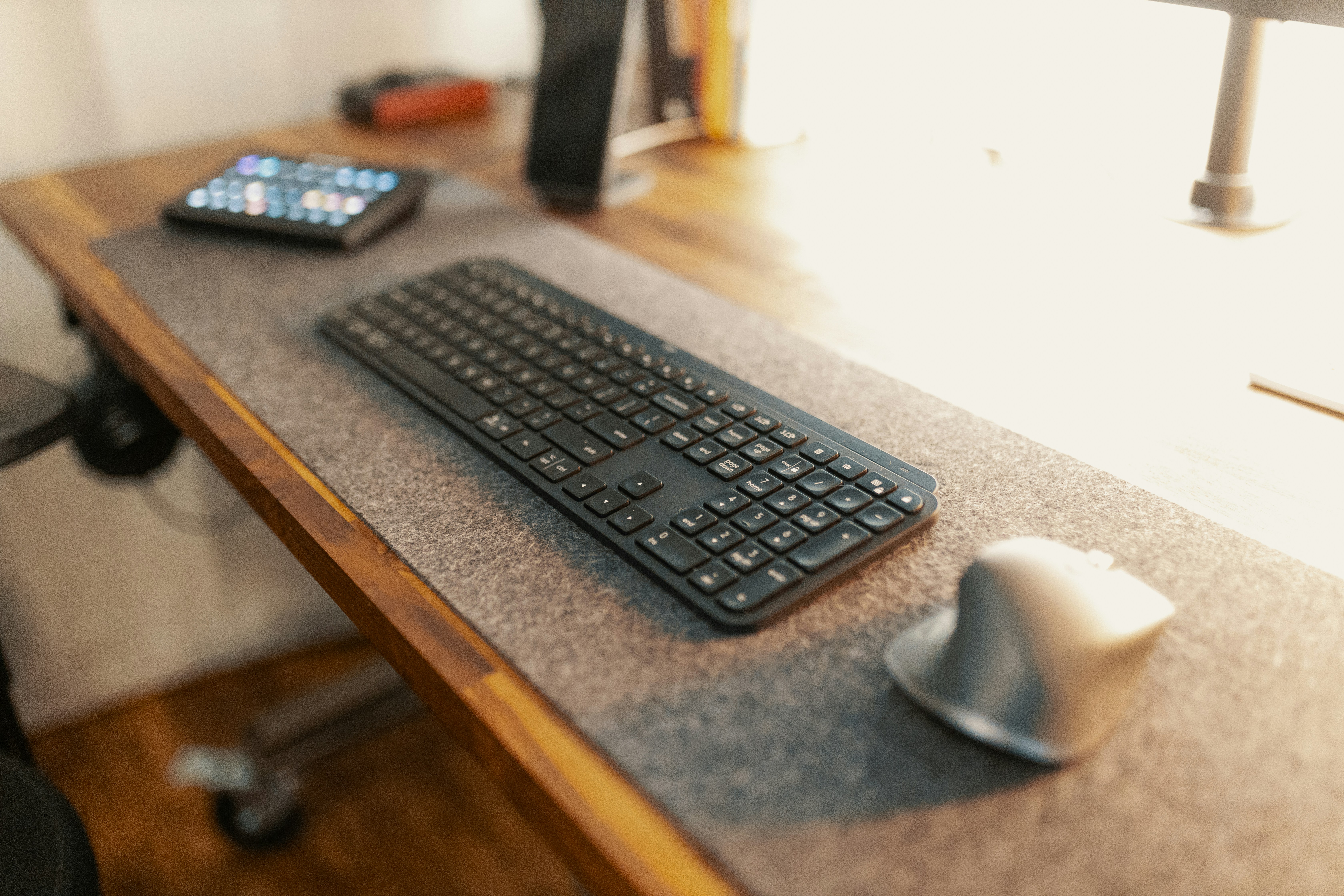 black computer keyboard on brown wooden table