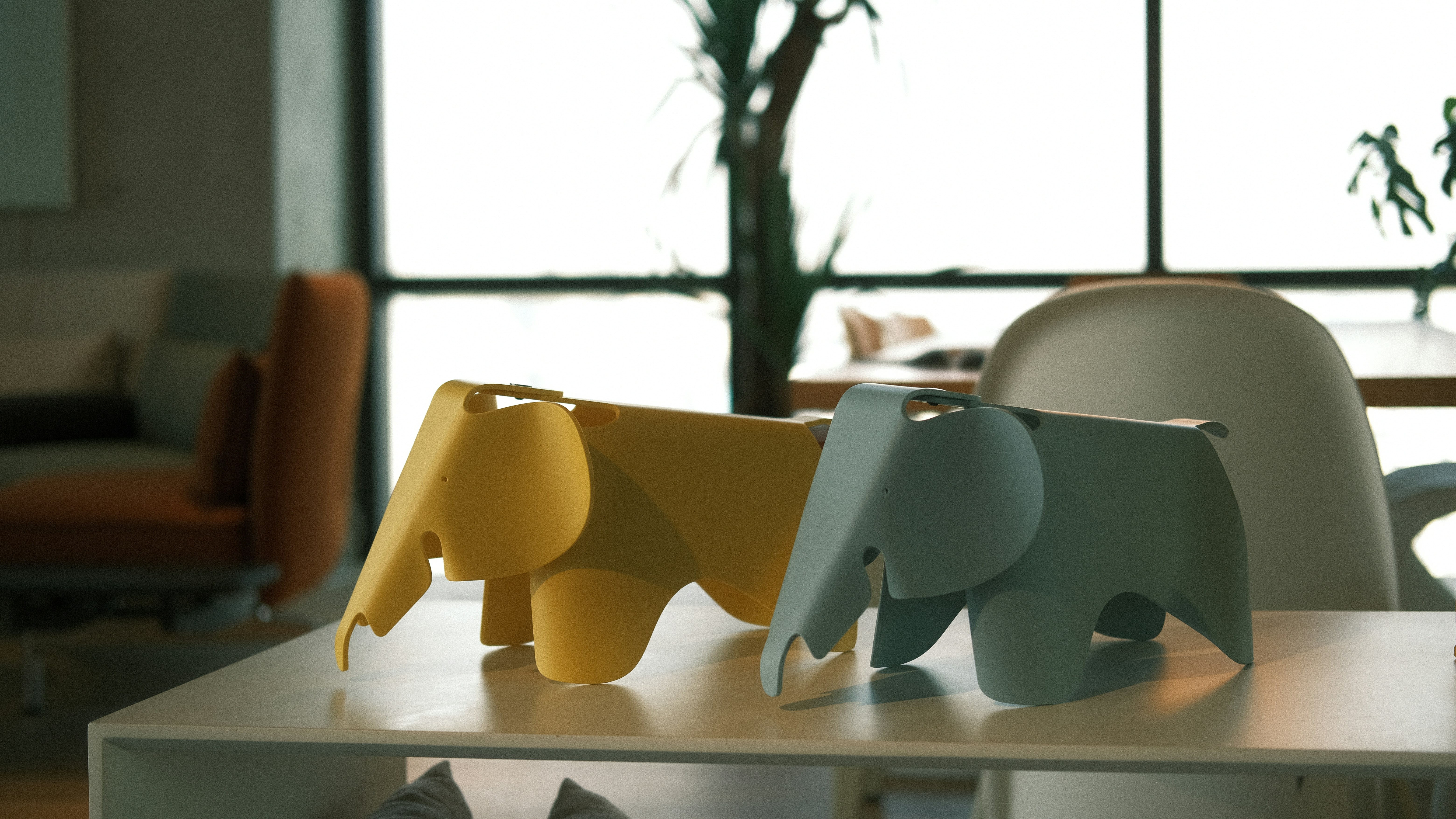 A group of elephant figurines sitting on top of a table