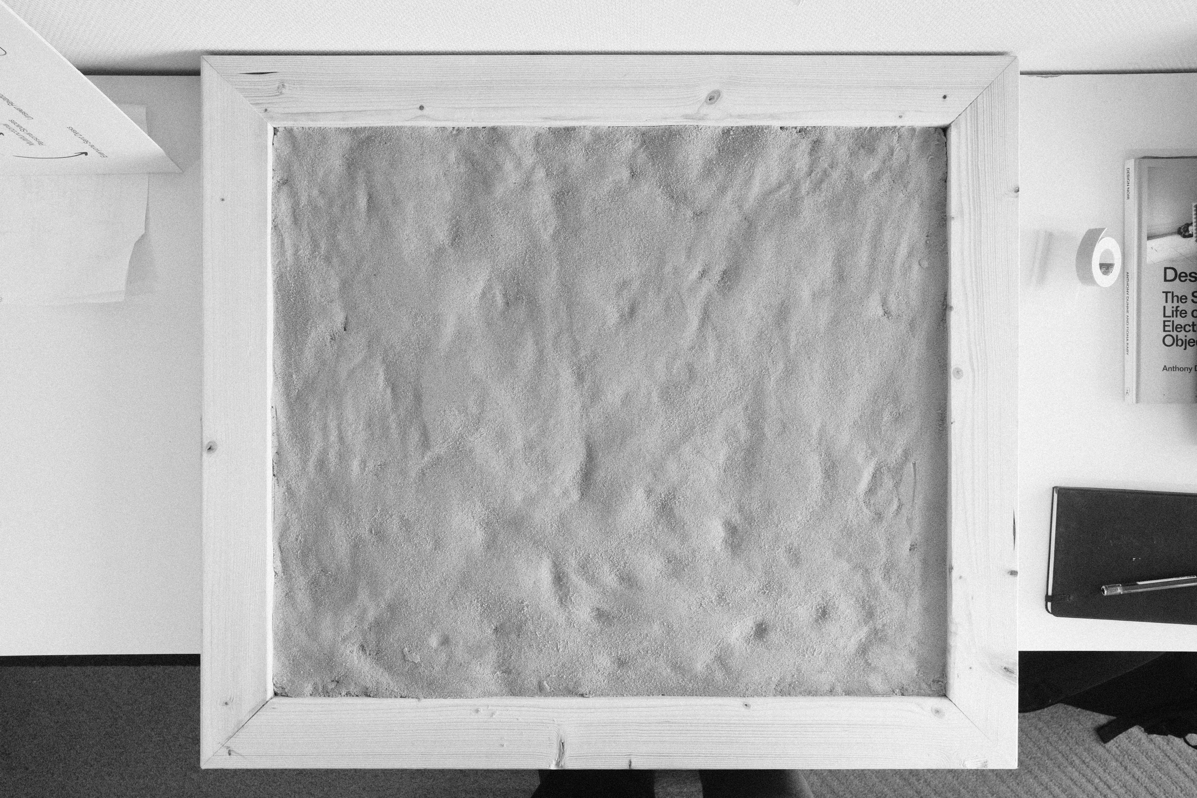 Tabula plaster surface in its wooden frame on a desk