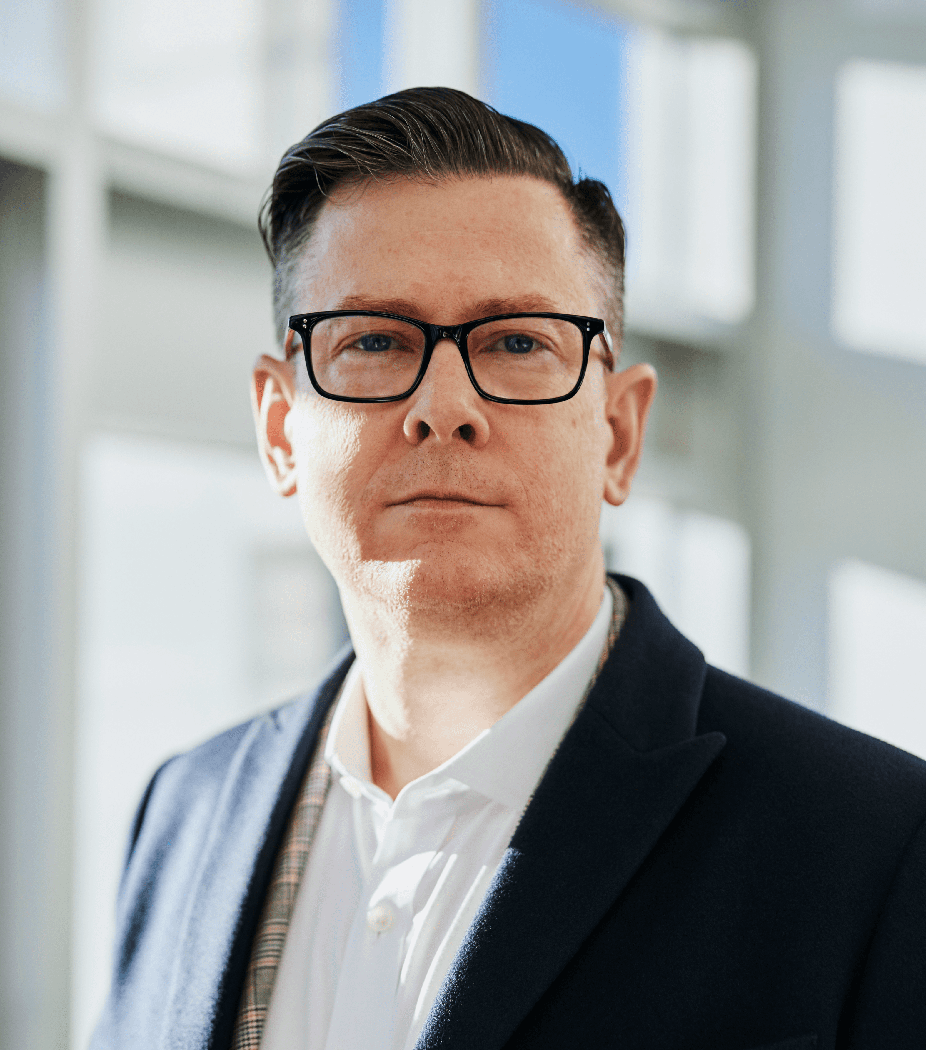 man standing beside wall