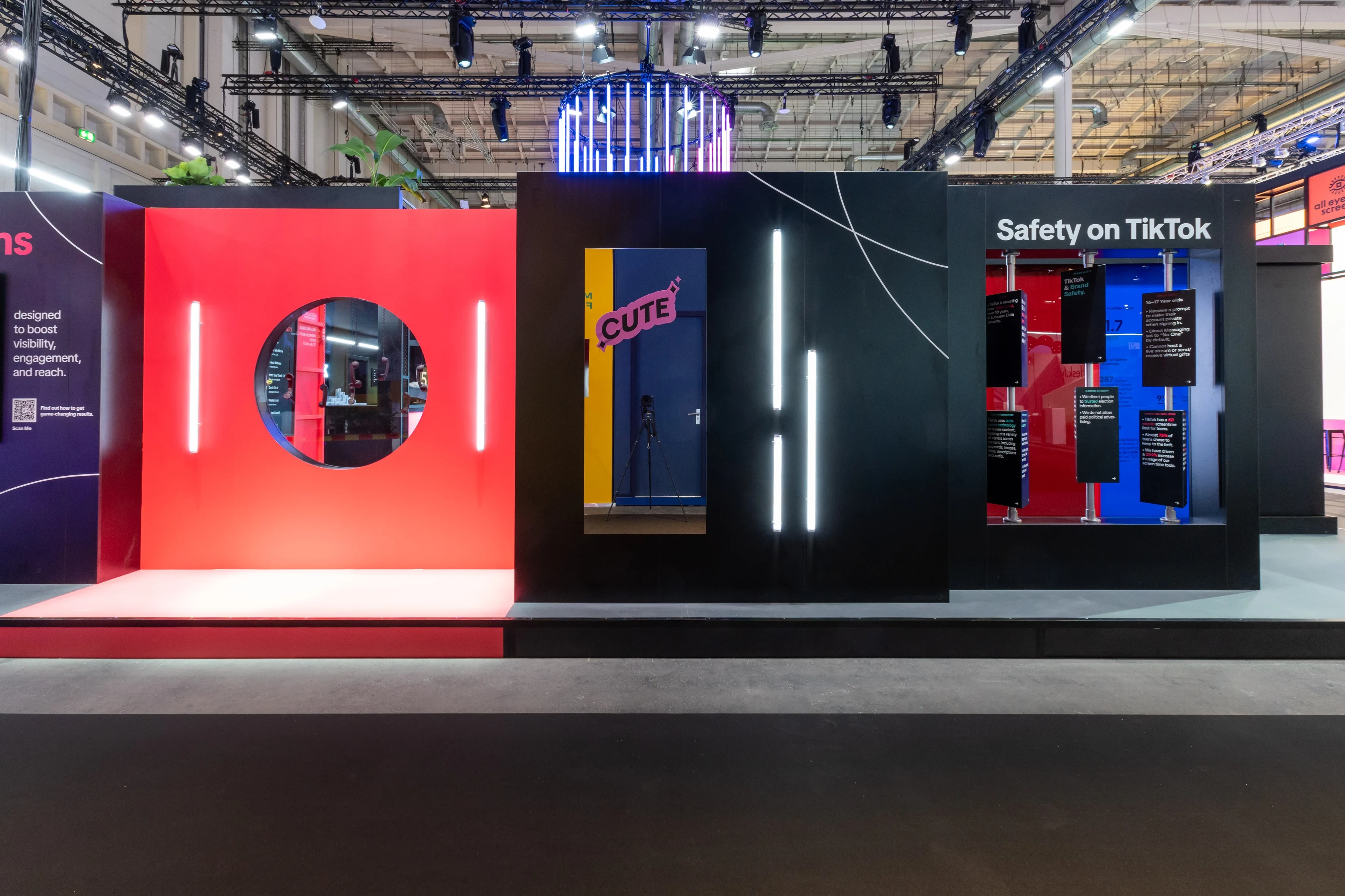 Show wall of the TikTok booth with red circular window, Cute mirror niche and Safety on TikTok display at OMR.