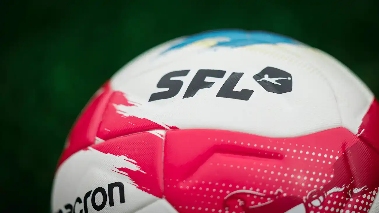 Close-up of a branded football displaying a prominent logo, illustrating logo usage rights, intellectual property and brand protection in sports sponsorship.