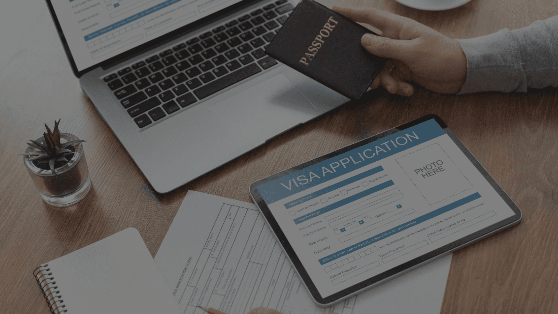 two people sitting on a bench looking at a mountain