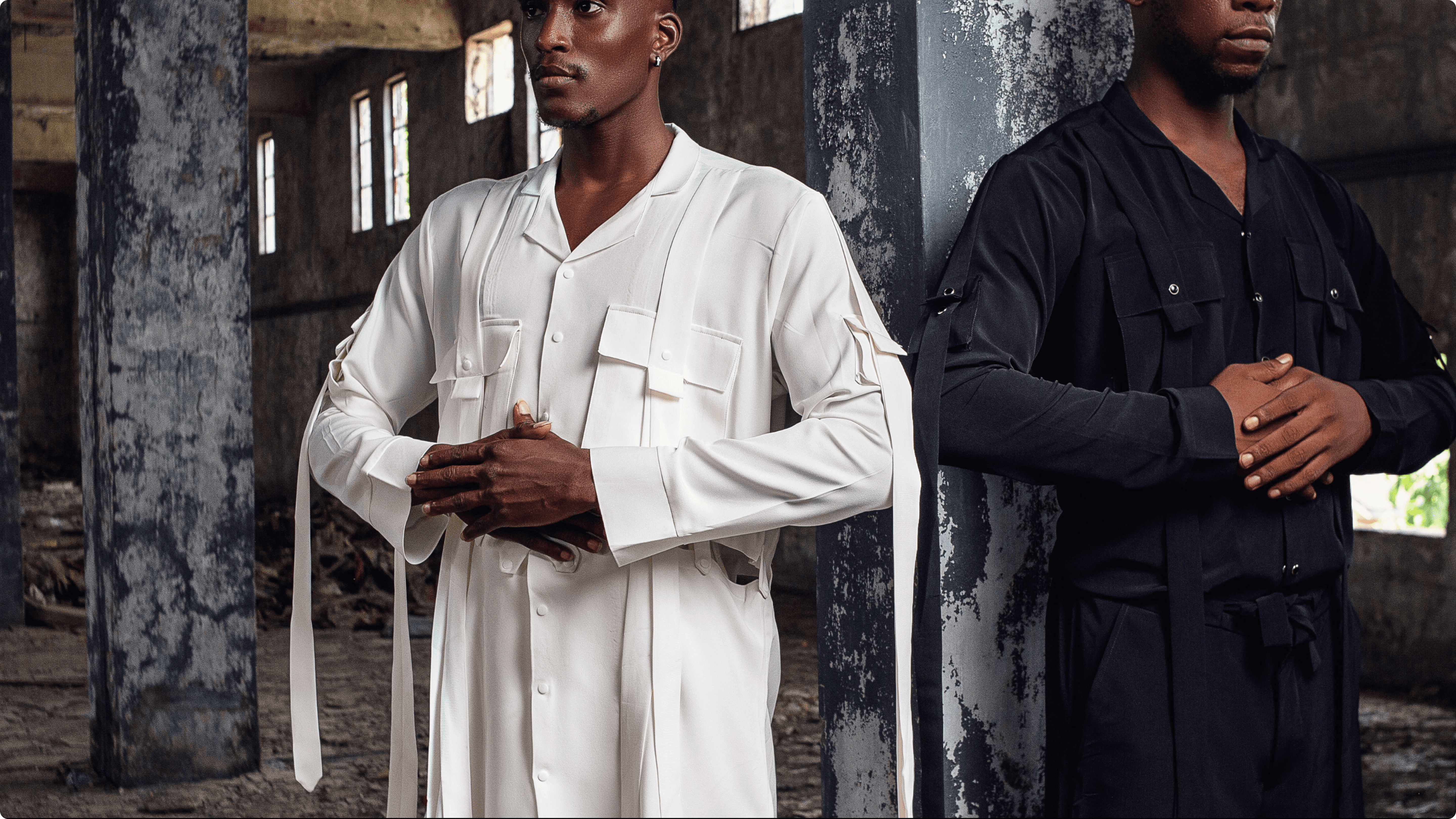 Black metallic foil pouch photographed from above, printed with a glossy white distressed smiley face logo (X eyes, tongue out) in the centre, faintly showing small white icon patterns beneath.