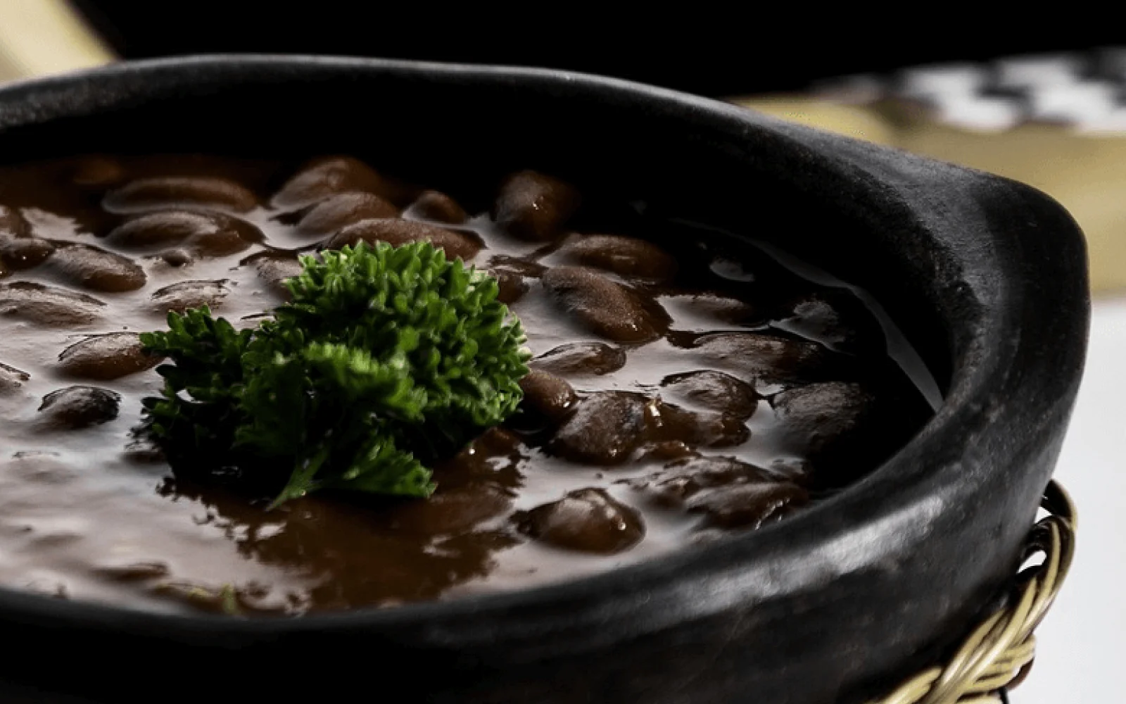 Costa Rican traditional dish of Casado in a black dish