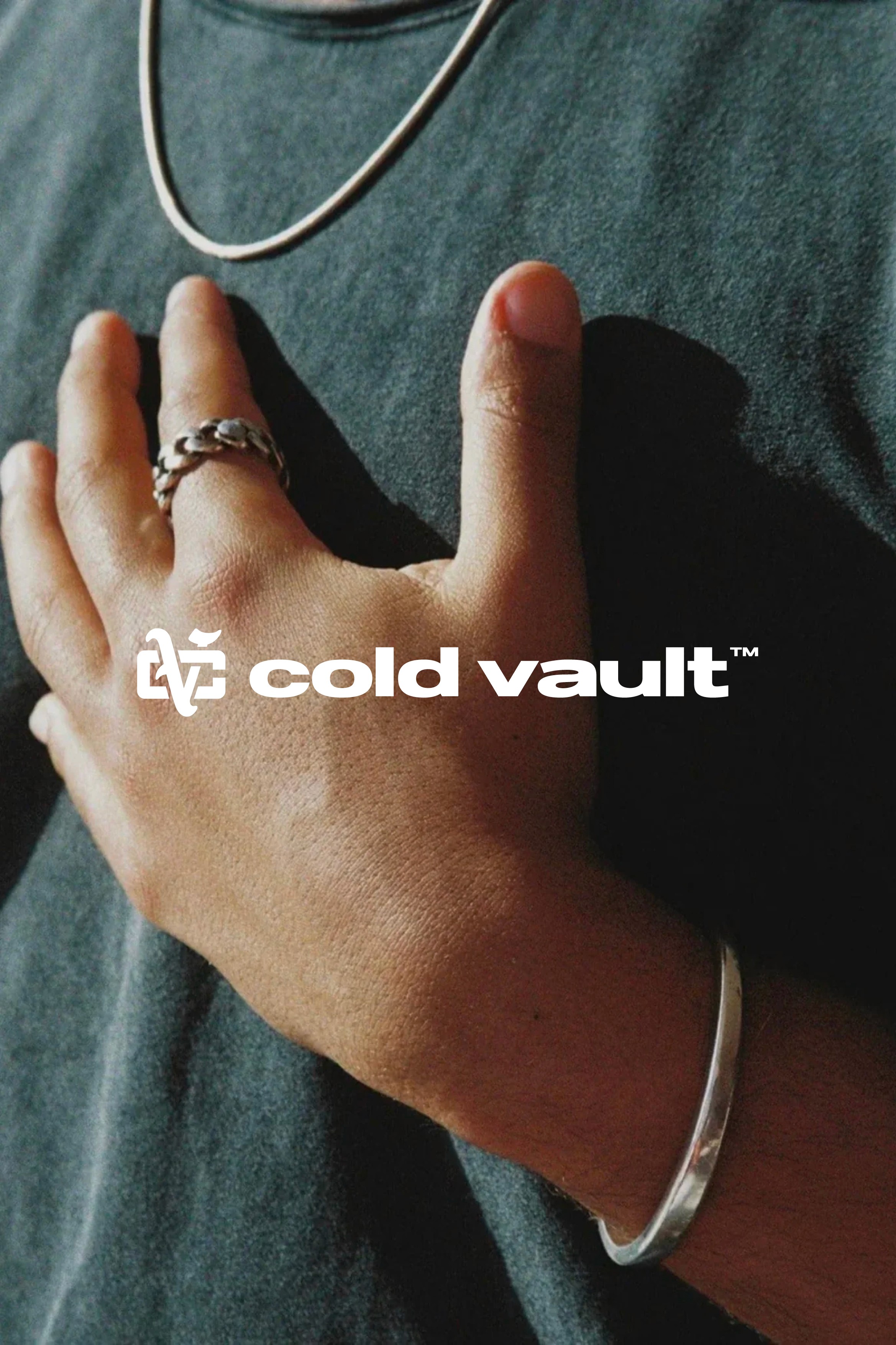 Lifestyle product photo featuring Cold Vault jewellery on model with logo overlay