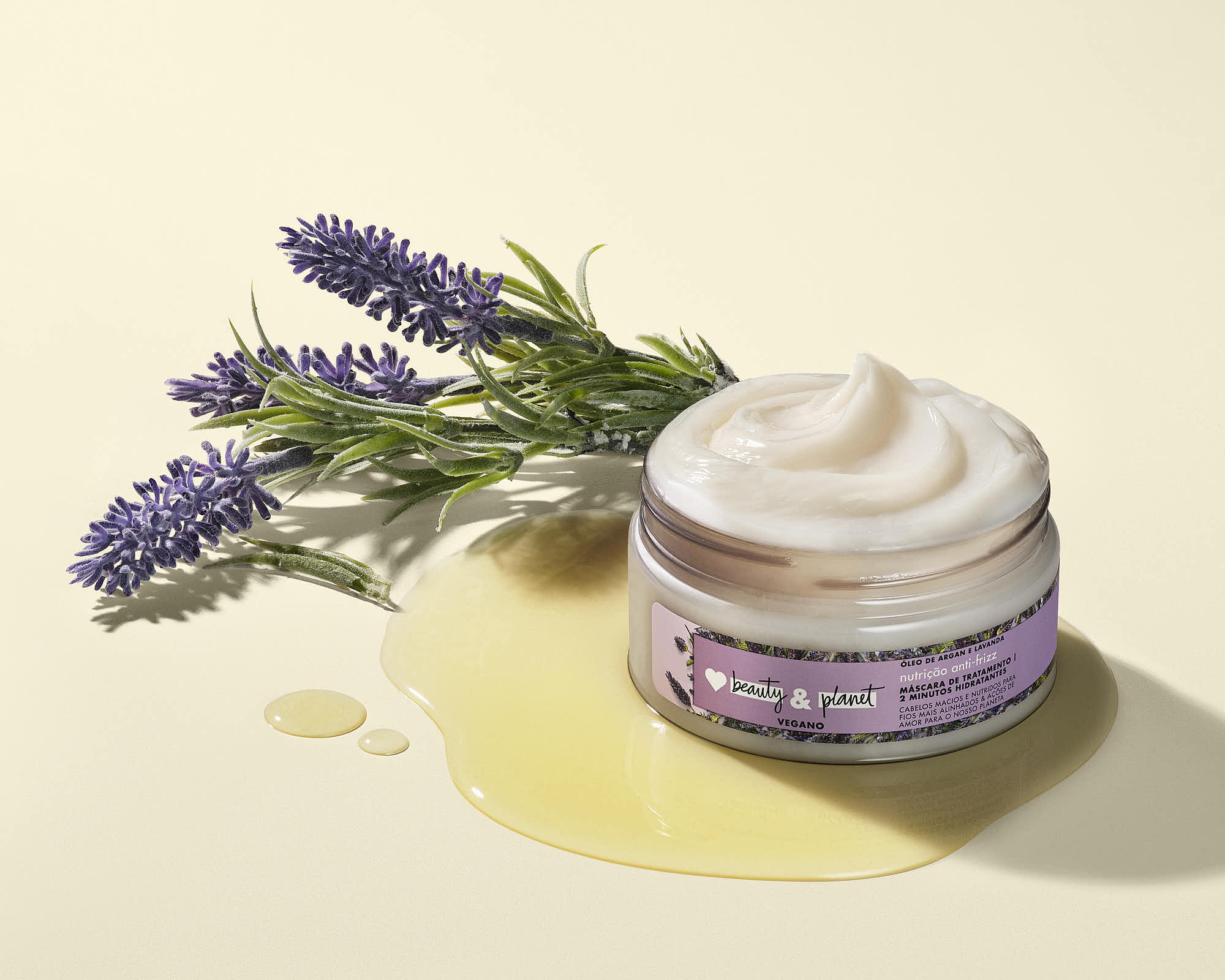 A lavender jar cream sits beside sprigs of lavender on a soft yellow background, evoking a calming atmosphere.