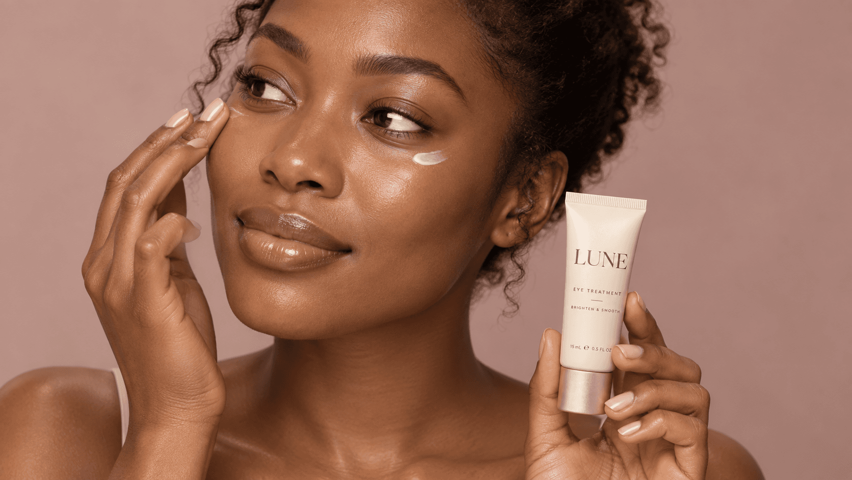 A woman using LUNE skincare