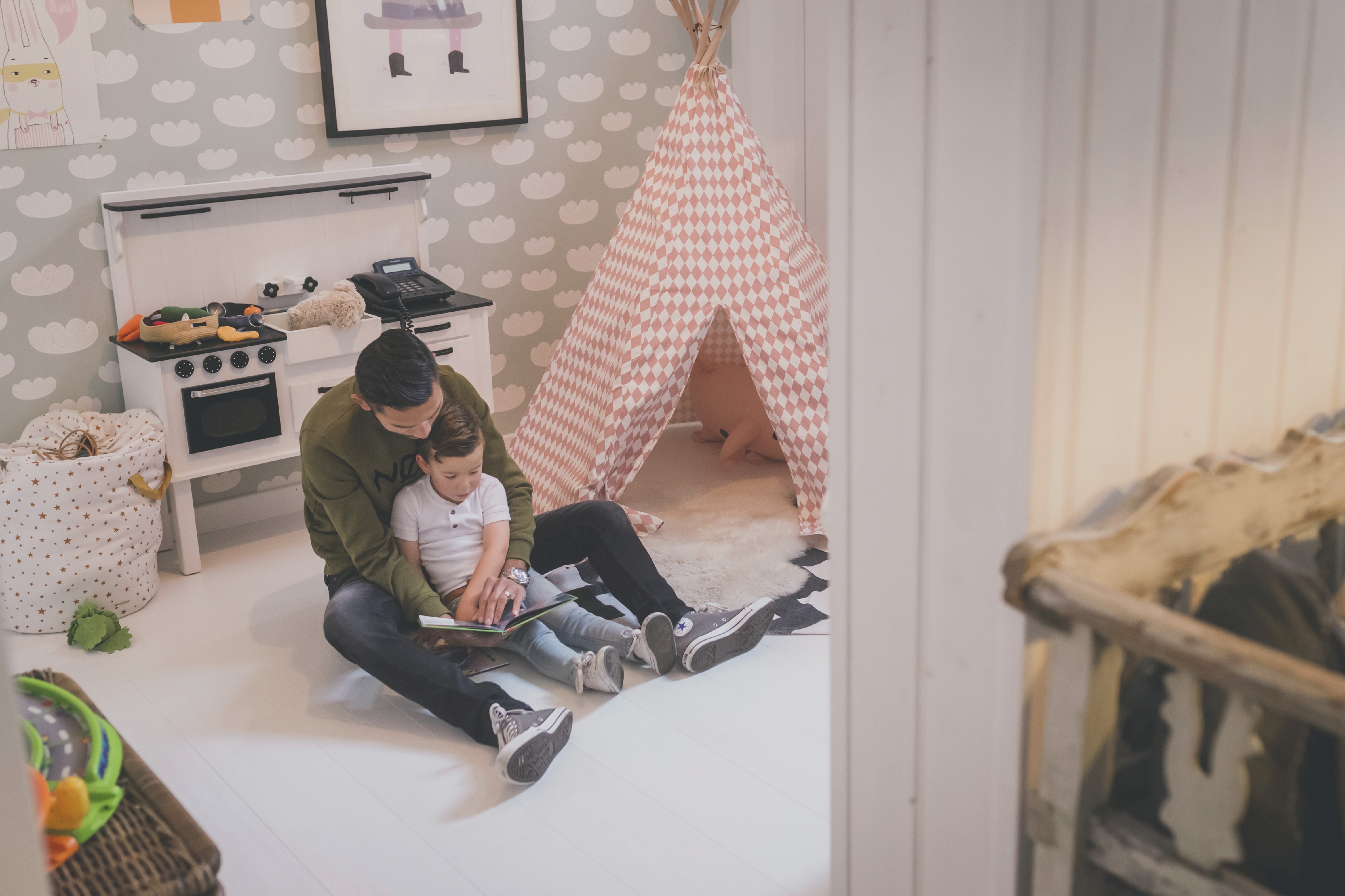 Dad reading a book with kid