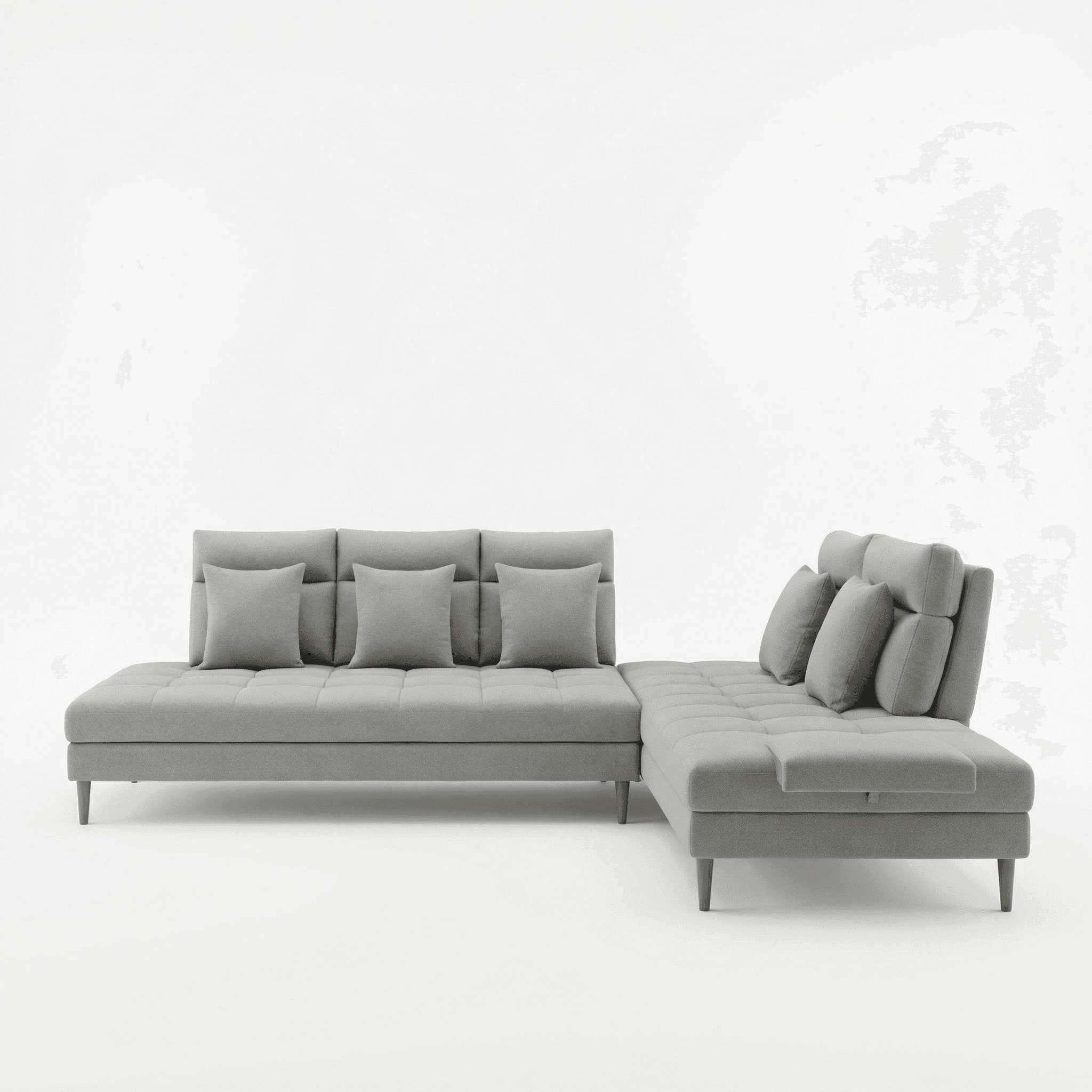 Low‑profile sectional sofa with soft grey upholstery and clean modern lines