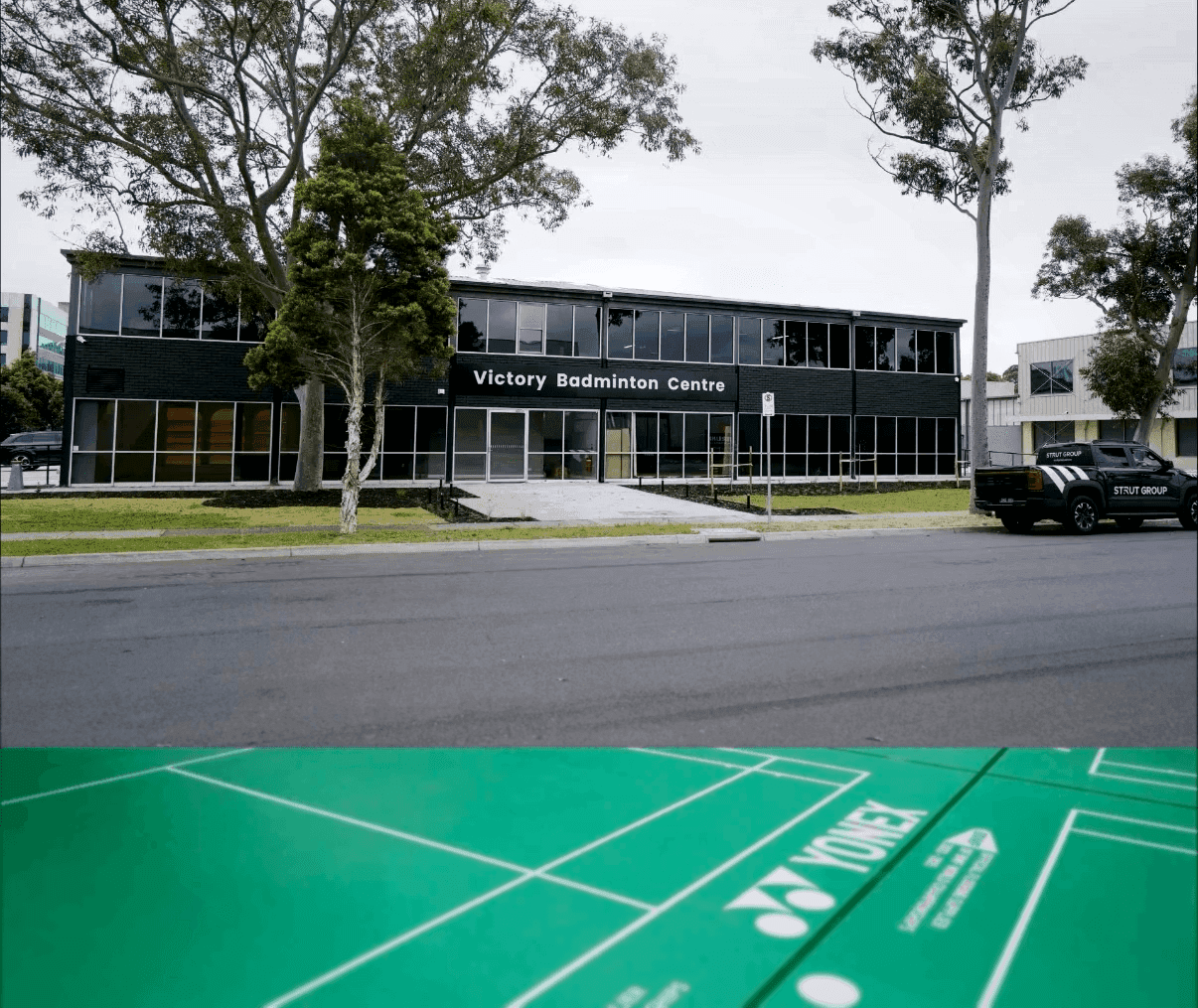 A modern building with plants growing on its balconies.