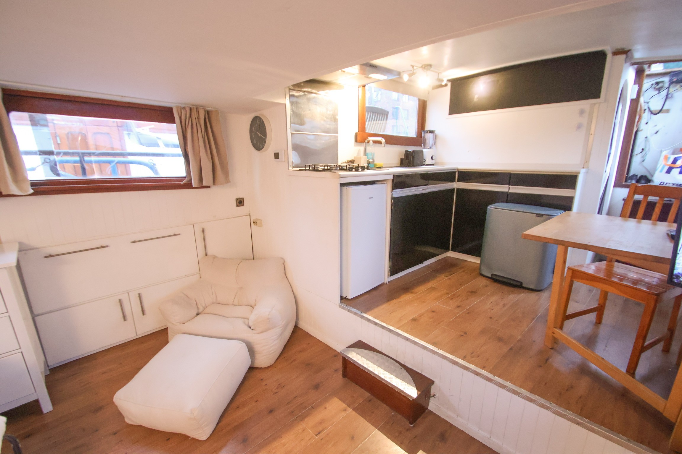 Modern office desk with angular design and leather chair